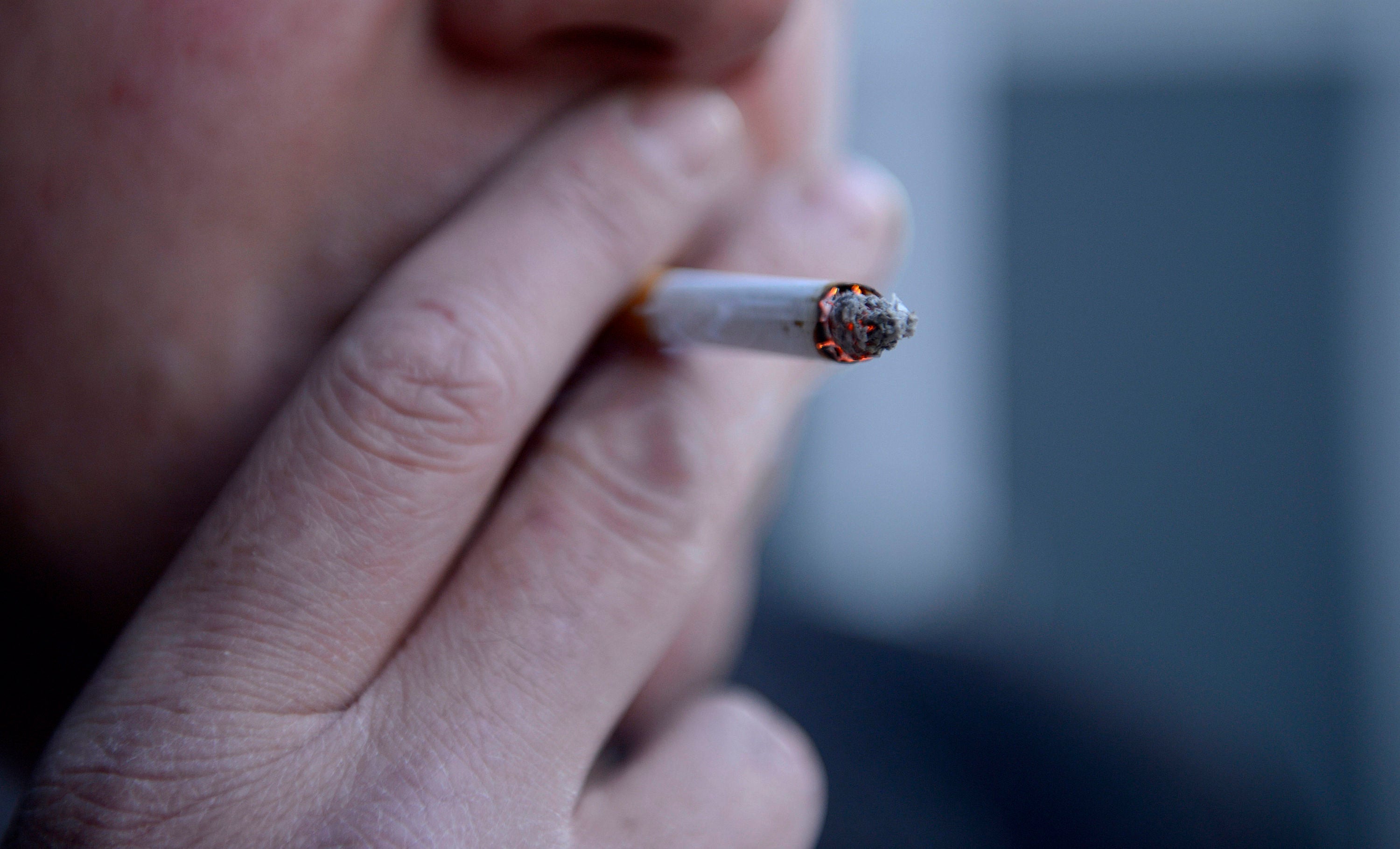 File photo dated 12/03/13 of a man smoking a cigarette.