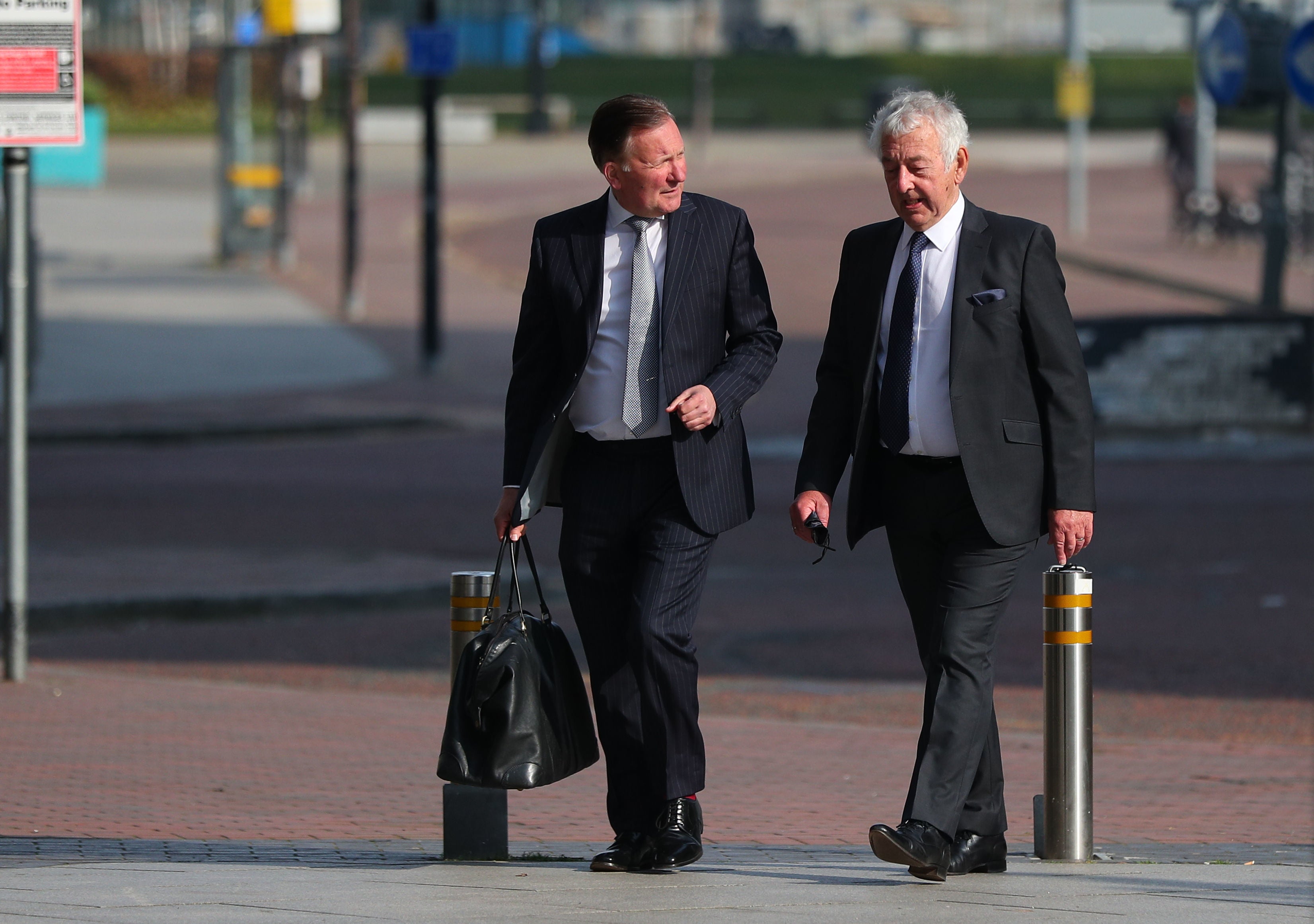 Retired South Yorkshire Police officer Alan Foster (right) has been accused in court of altering statements in the aftermath of the Hillsborough disaster alongside ex-chief superintendent Donald Denton and lawyer Peter Metcalf