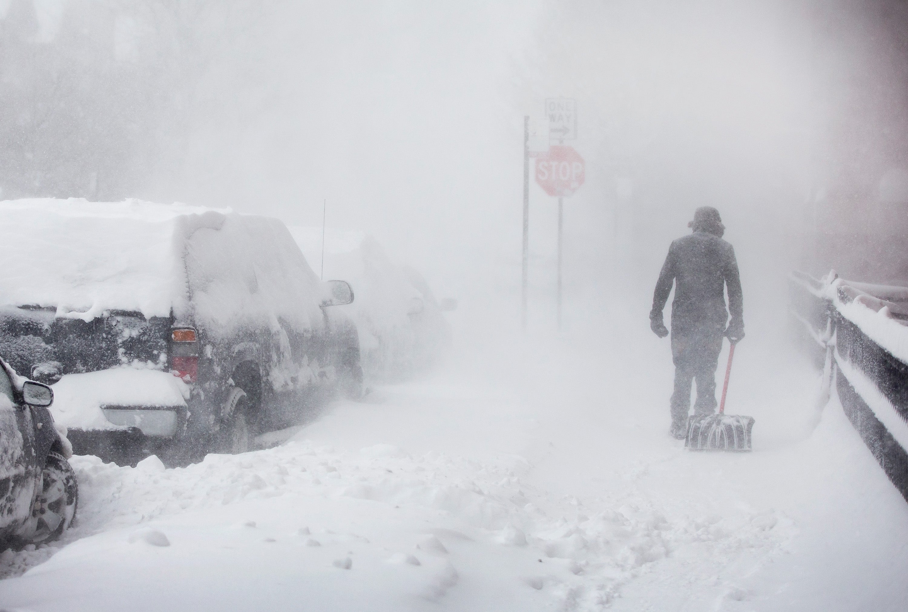 Global freezing: a pedestrian navigates a snow-covered street in Chicago, Illinois