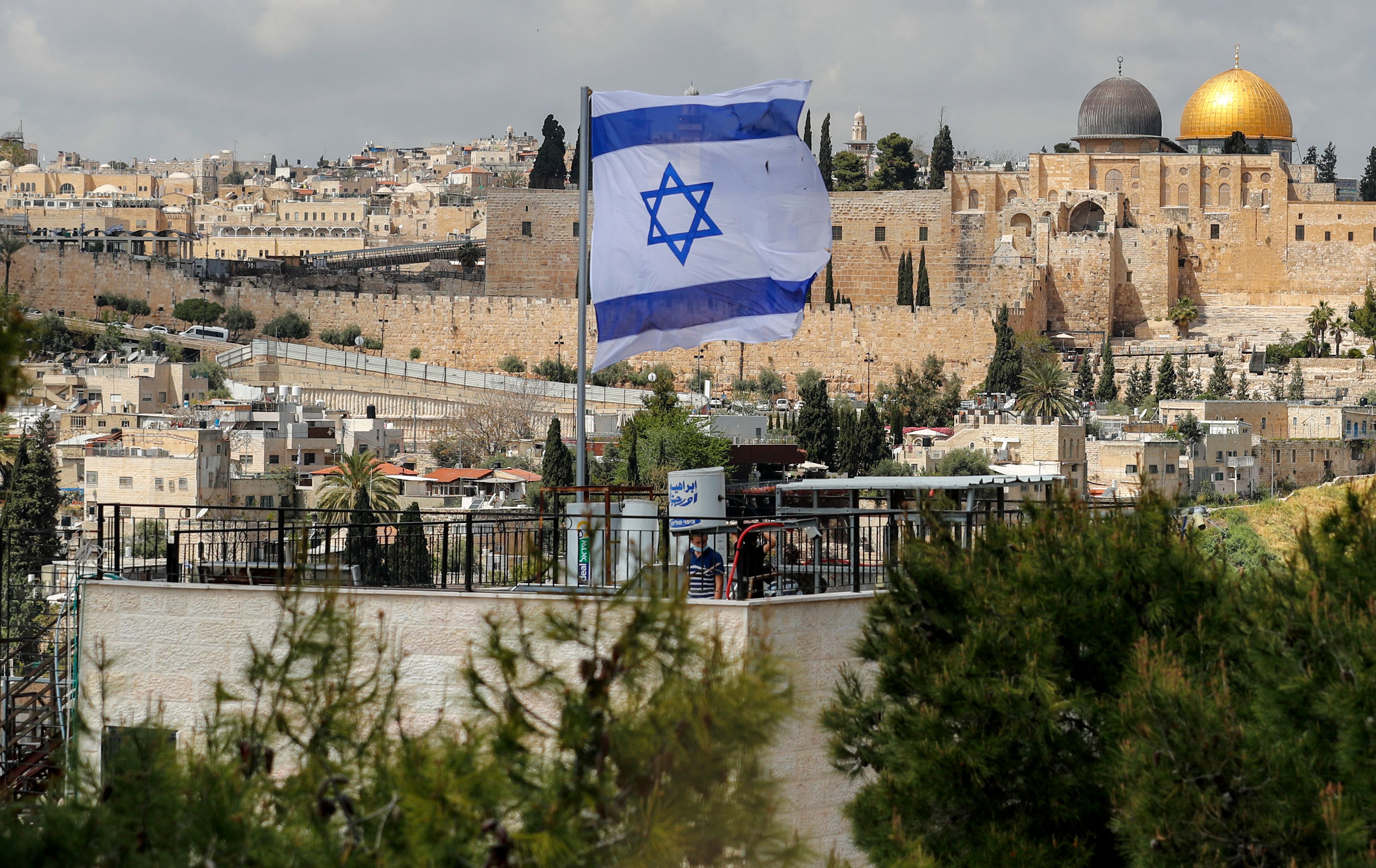 An Israeli flag flies over a home recently inhabited by Jewish sttlers, in Israeli-annexed east Jerusalem's predominantly Arab neighbourhood of Silwan