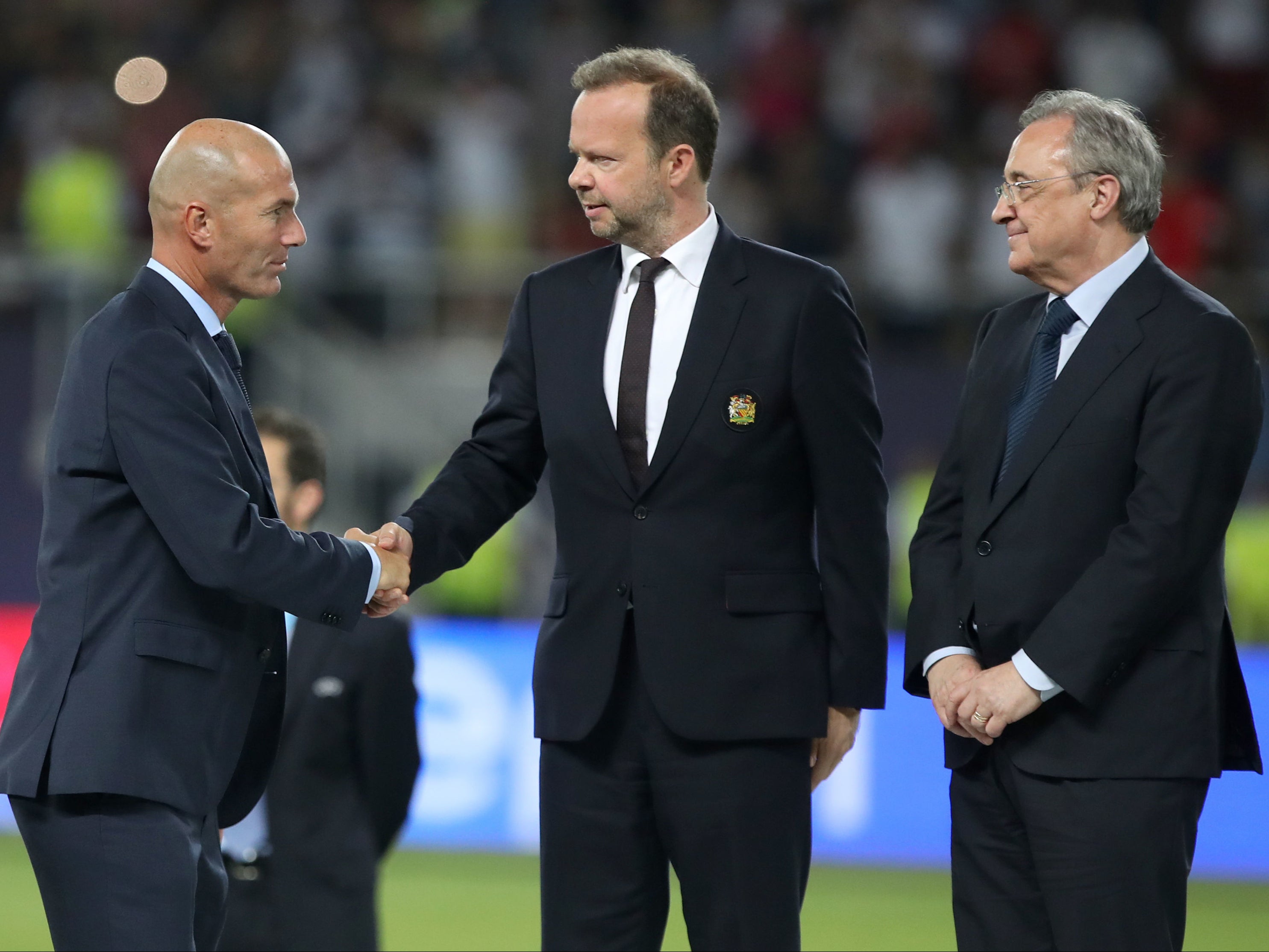 Florentino Perez, right, with Ed Woodward, centre, and Zinedine Zidane