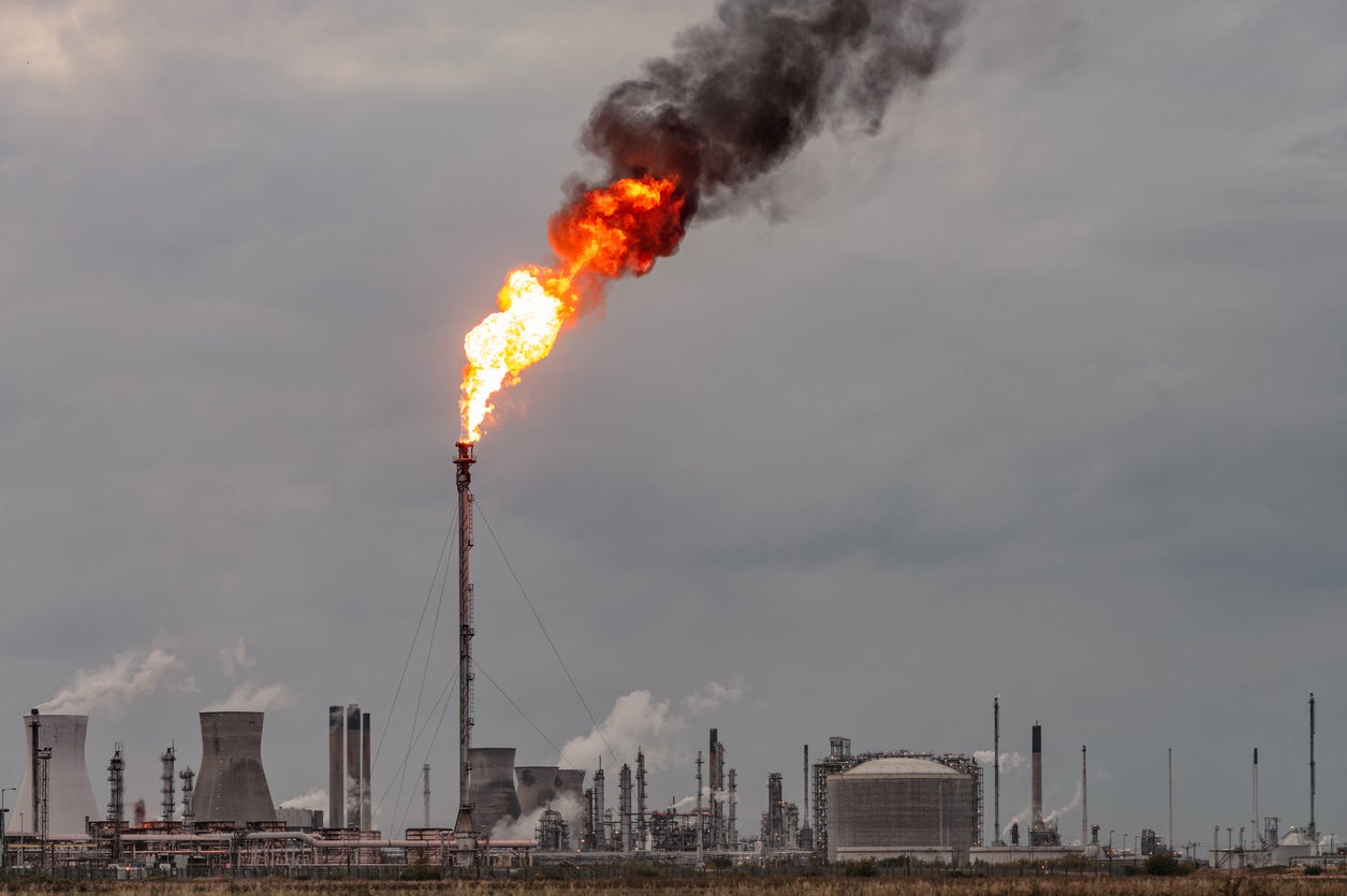 Smoke rising from an oil refinery and petrochemical plant in Scotland