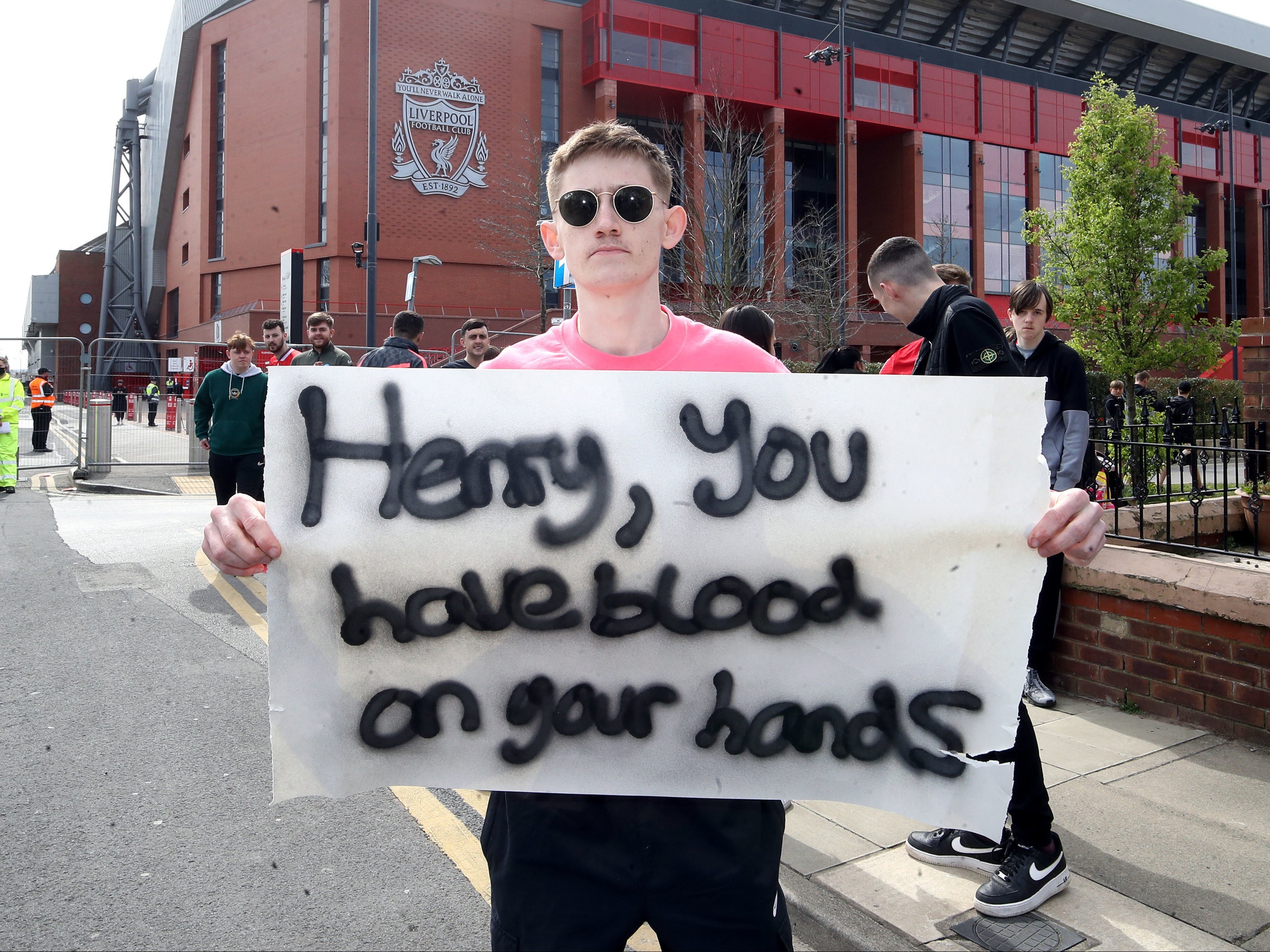 Liverpool fans protest against owner John Henry