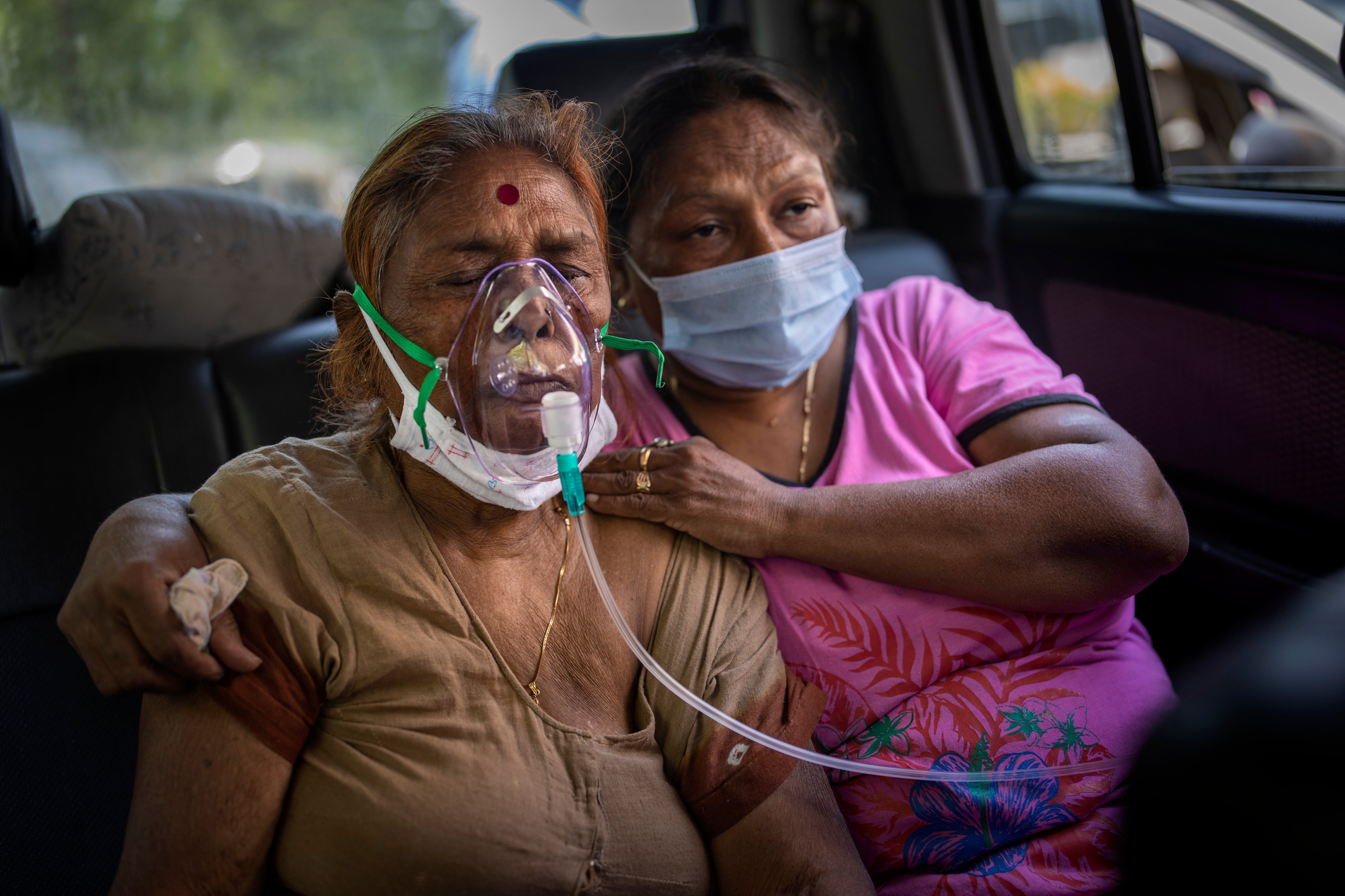 A Covid patient receives oxygen inside a car provided by a gurdwara, a Sikh house of worship, in New Delhi, India in April last year amid a dire shortage of oxygen cylinders