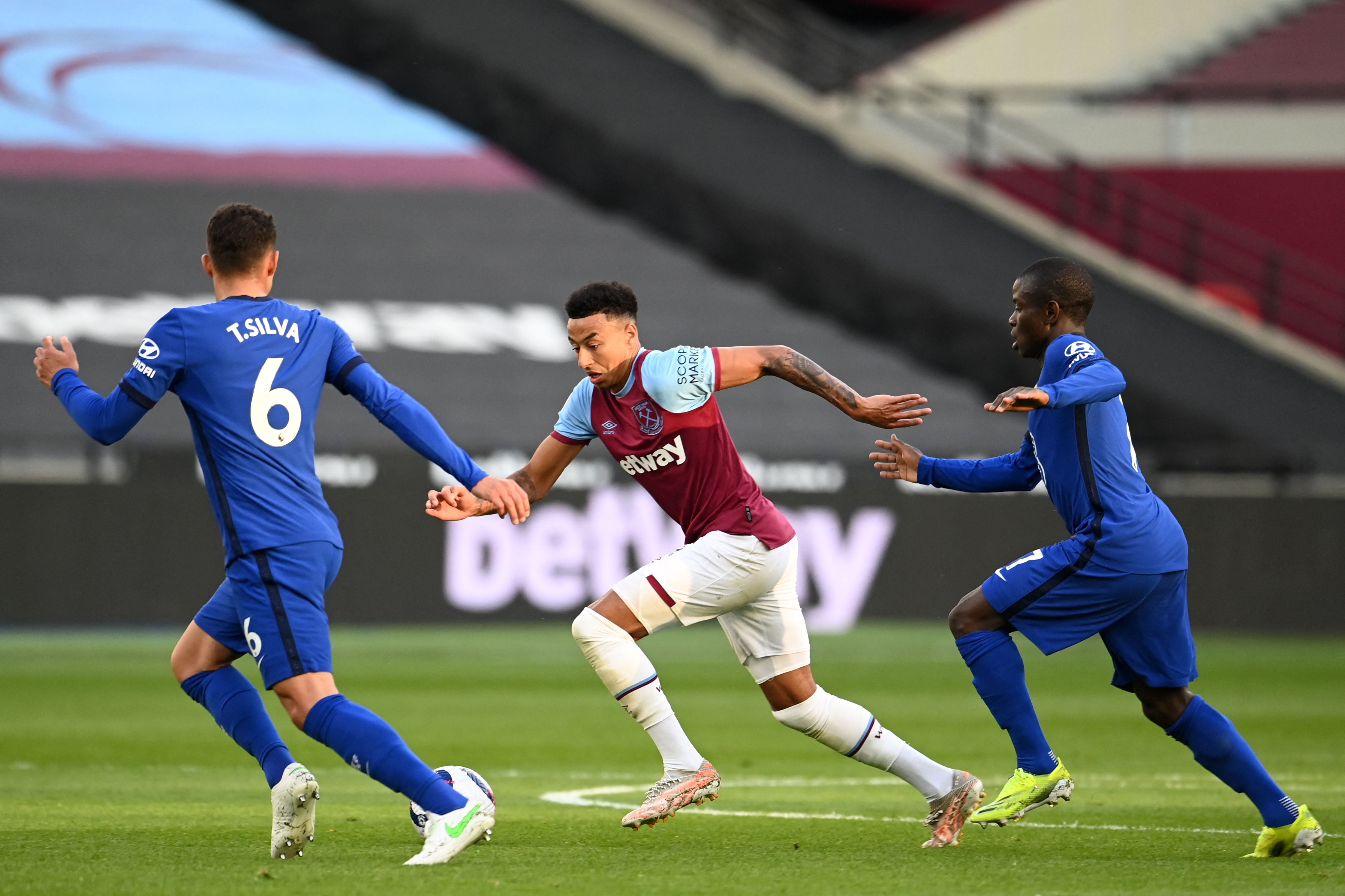 West Ham United’s Jesse Lingard vies with Chelsea’s Thiago Silva and N’Golo Kante