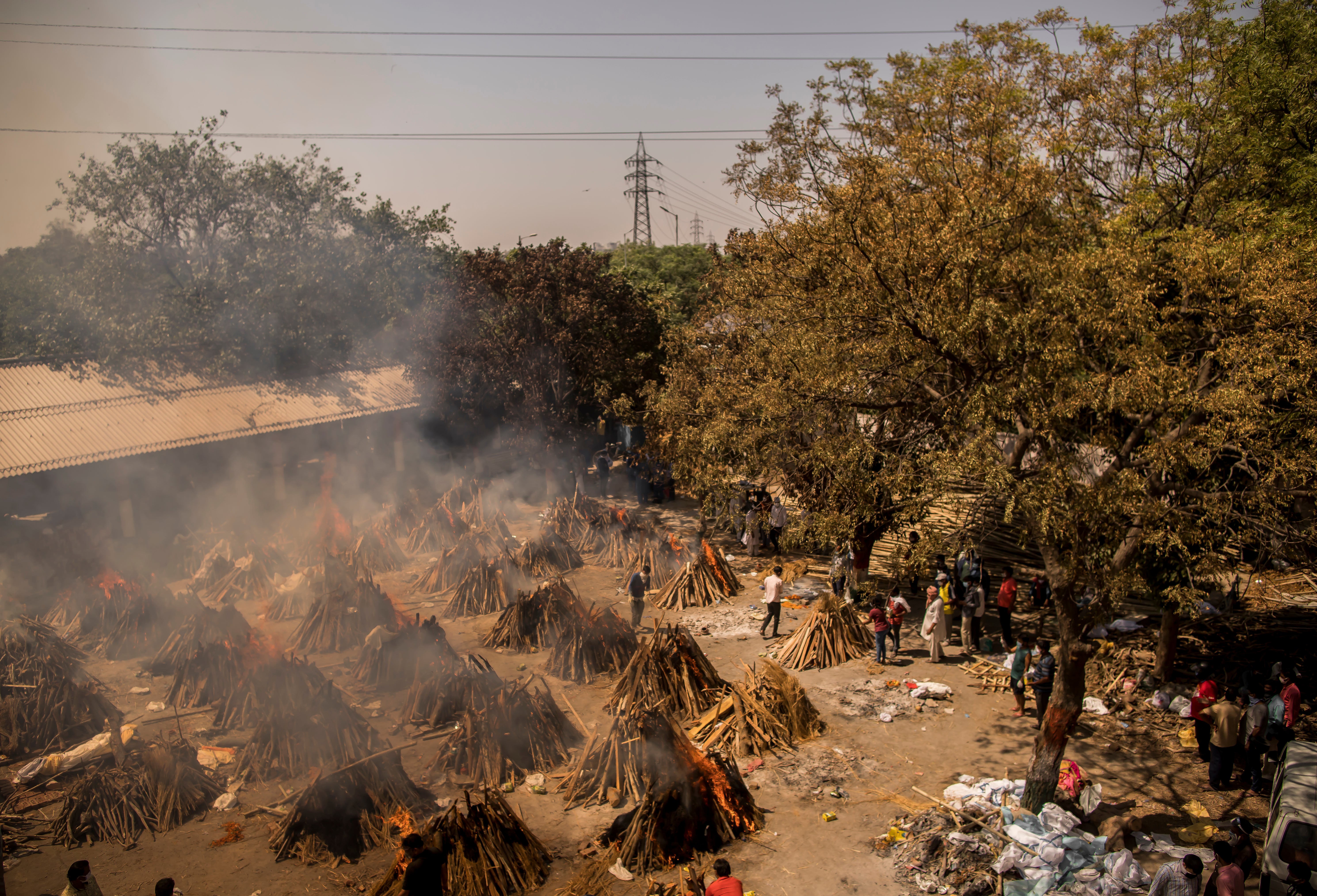 A general view of multiple burning funeral pyres of patients who died of the Covid-19 coronavirus disease at a crematorium on April 24, 2021 in New Delhi, India.