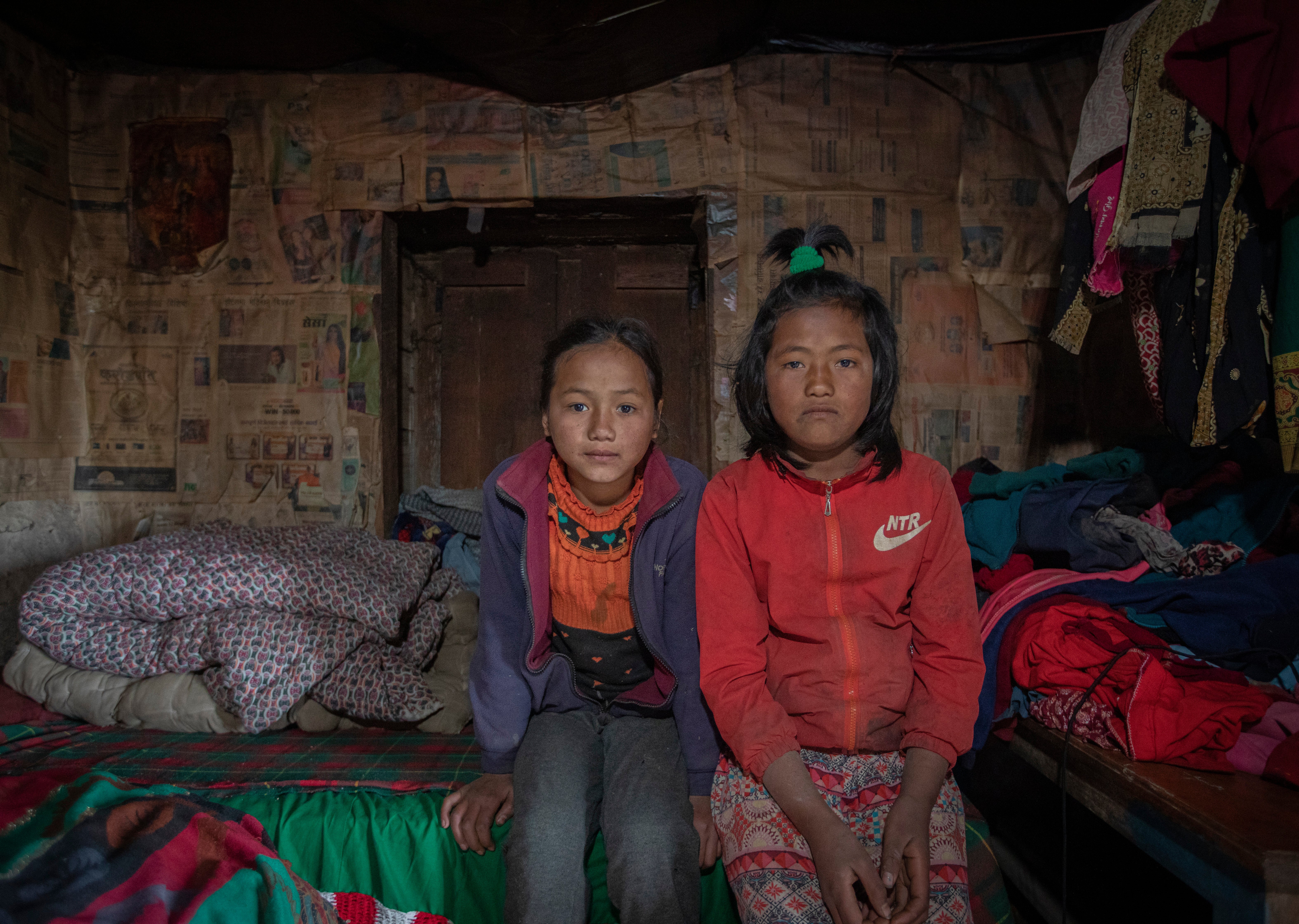 Sisters Heena and Soyeena, 10 and 11, sit on the bed they share. They live with their Aunt and Uncle as their mother left and their father is working in Malaysia so he can send money back to the family. Soyeena says “My problem is not being able to go to school, but I feel happy now I can see a school being built in the village. I’ll be so glad to study rather than be working.”