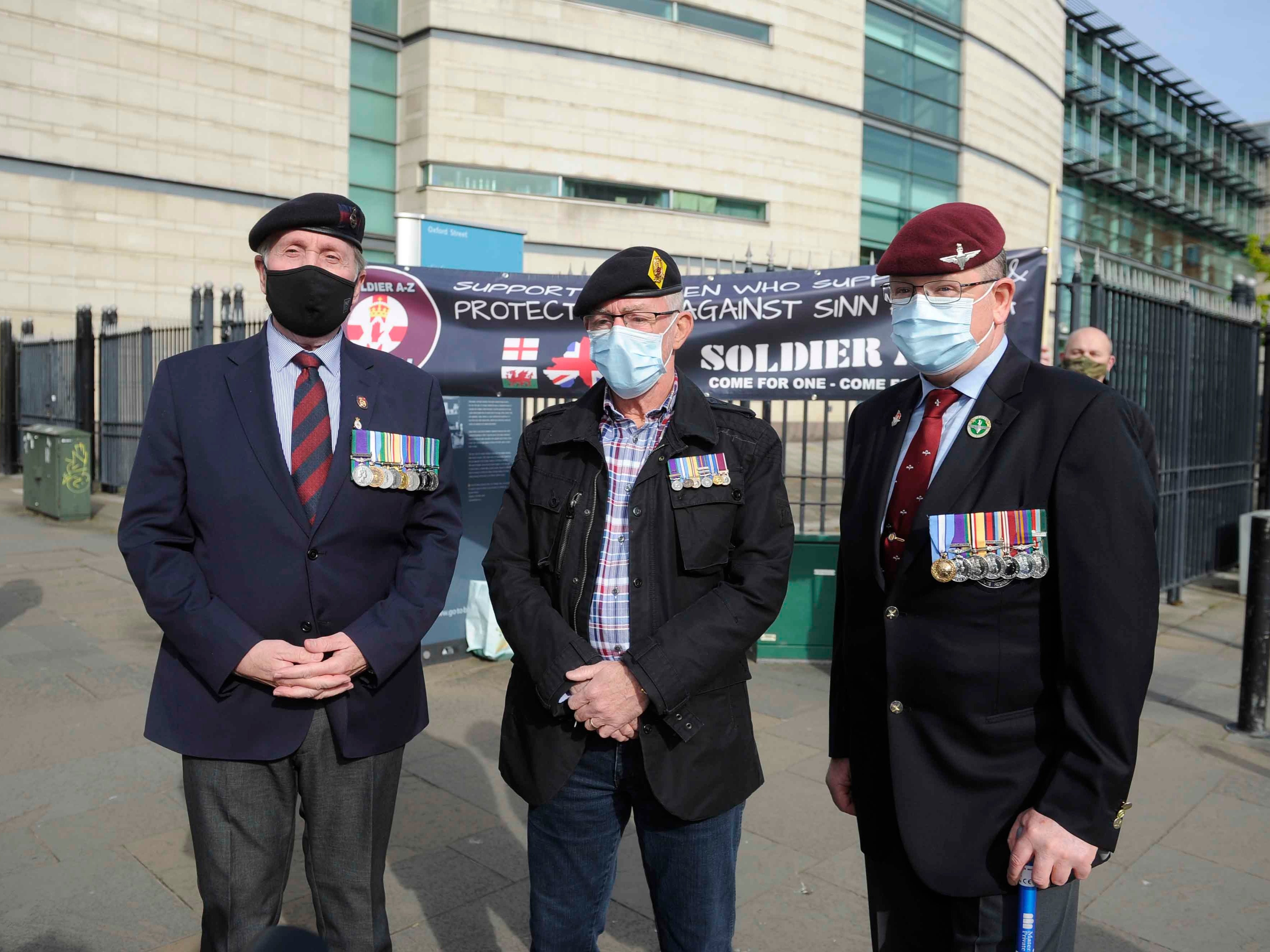 Veterans and supporters of soldier A and C outside Laganside Courts in Belfast where two former paratroopers deny murdering a man in Northern Ireland almost 50 years ago