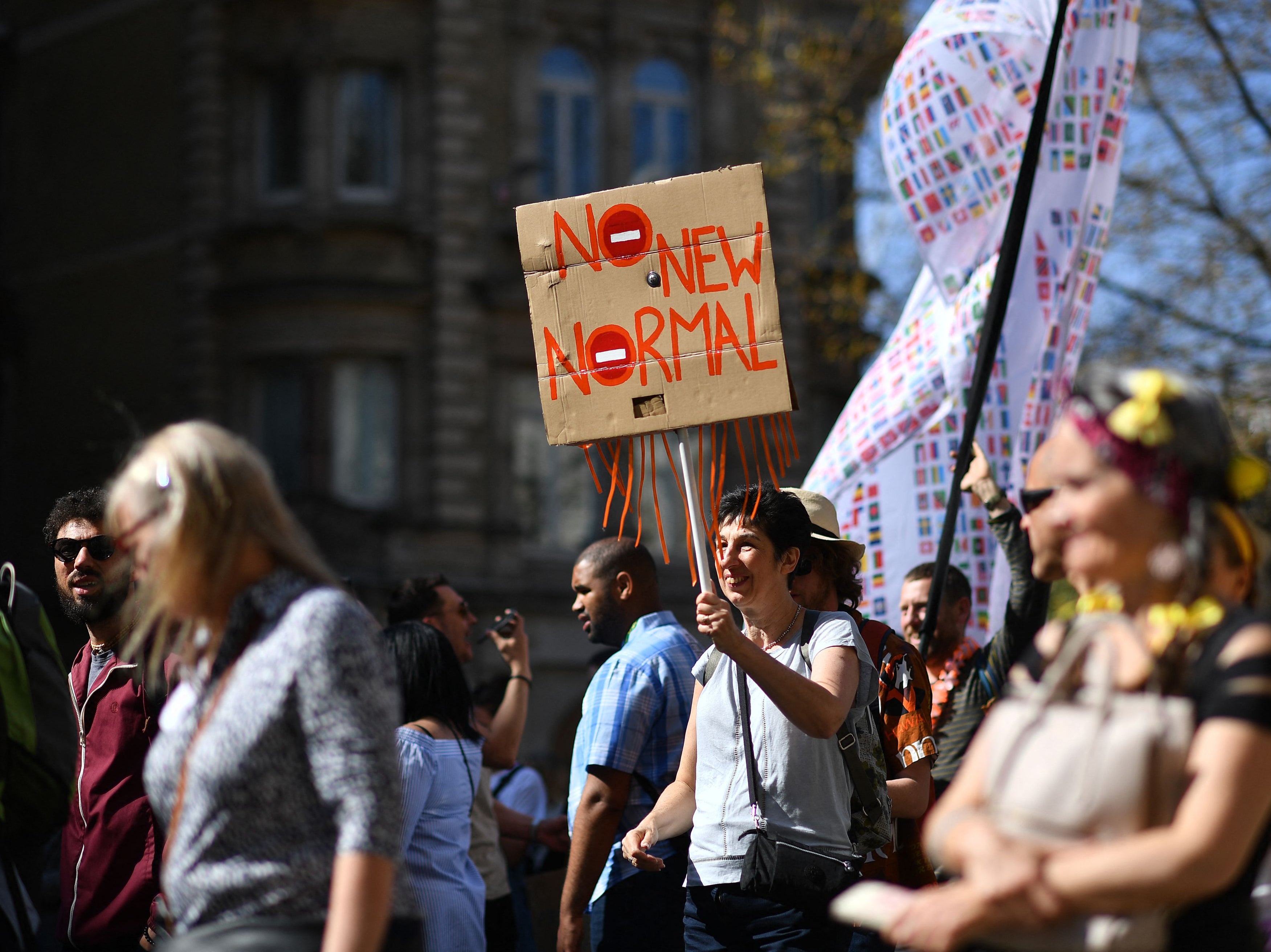 Demonstrators take part in an anti-lockdown, anti-Covid-19 vaccination passport protest in central London