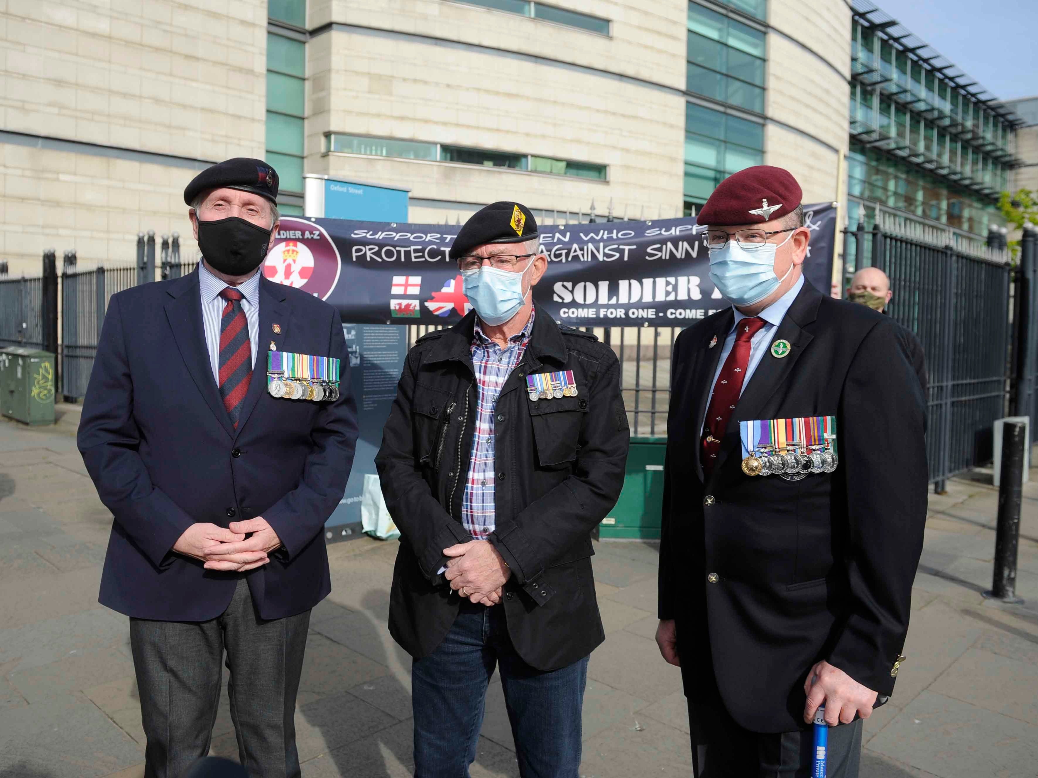 Veterans and supporters of soldier A and C outside Laganside Courts in Belfast where two former paratroopers deny murdering a man in Northern Ireland almost 50 years ago