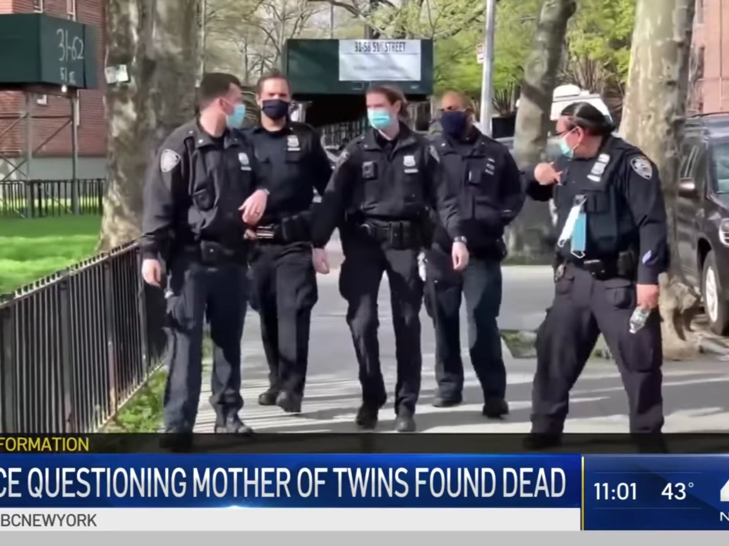 Officers search an apartment after deaths of twins in Queens, New York