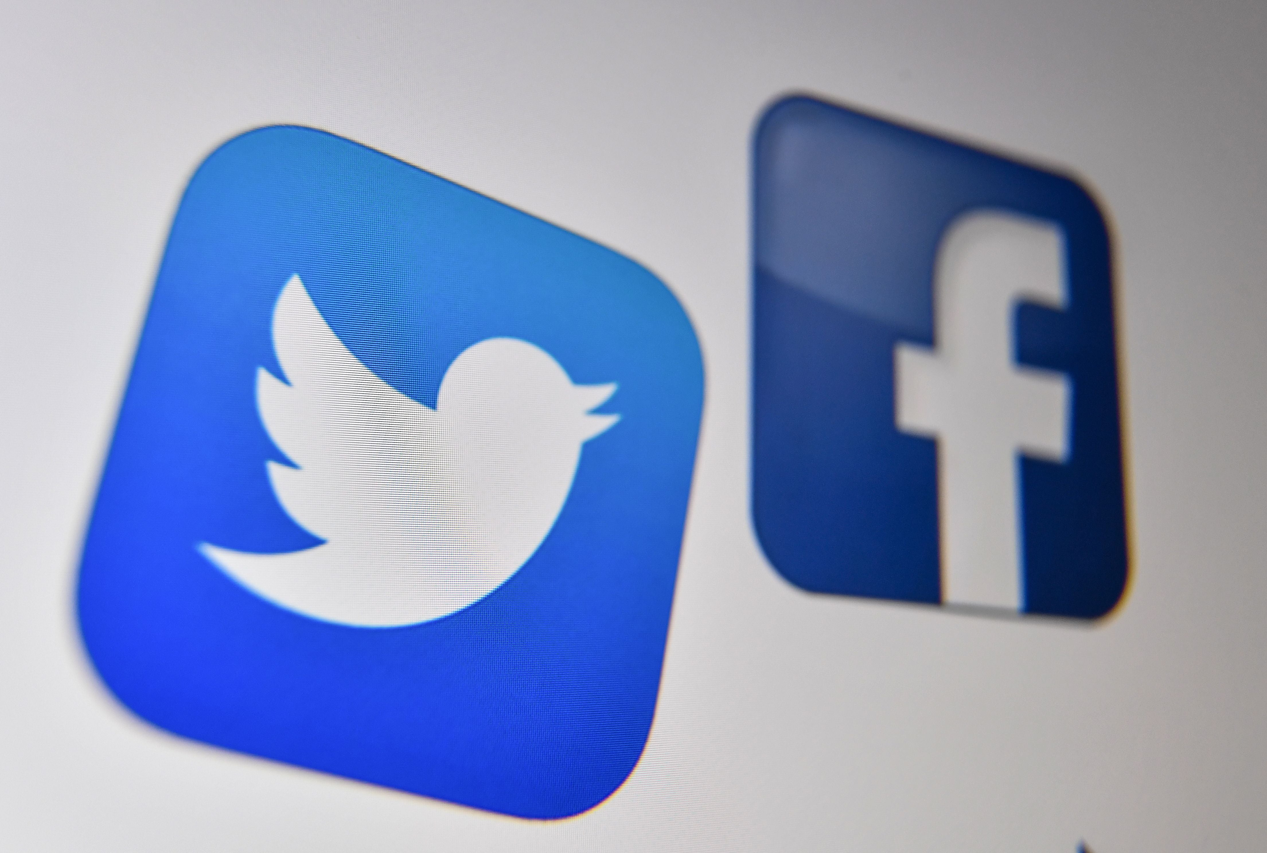 Logo of the the American online social media and social networking service, Facebook and Twitter on a computer screen in Lille