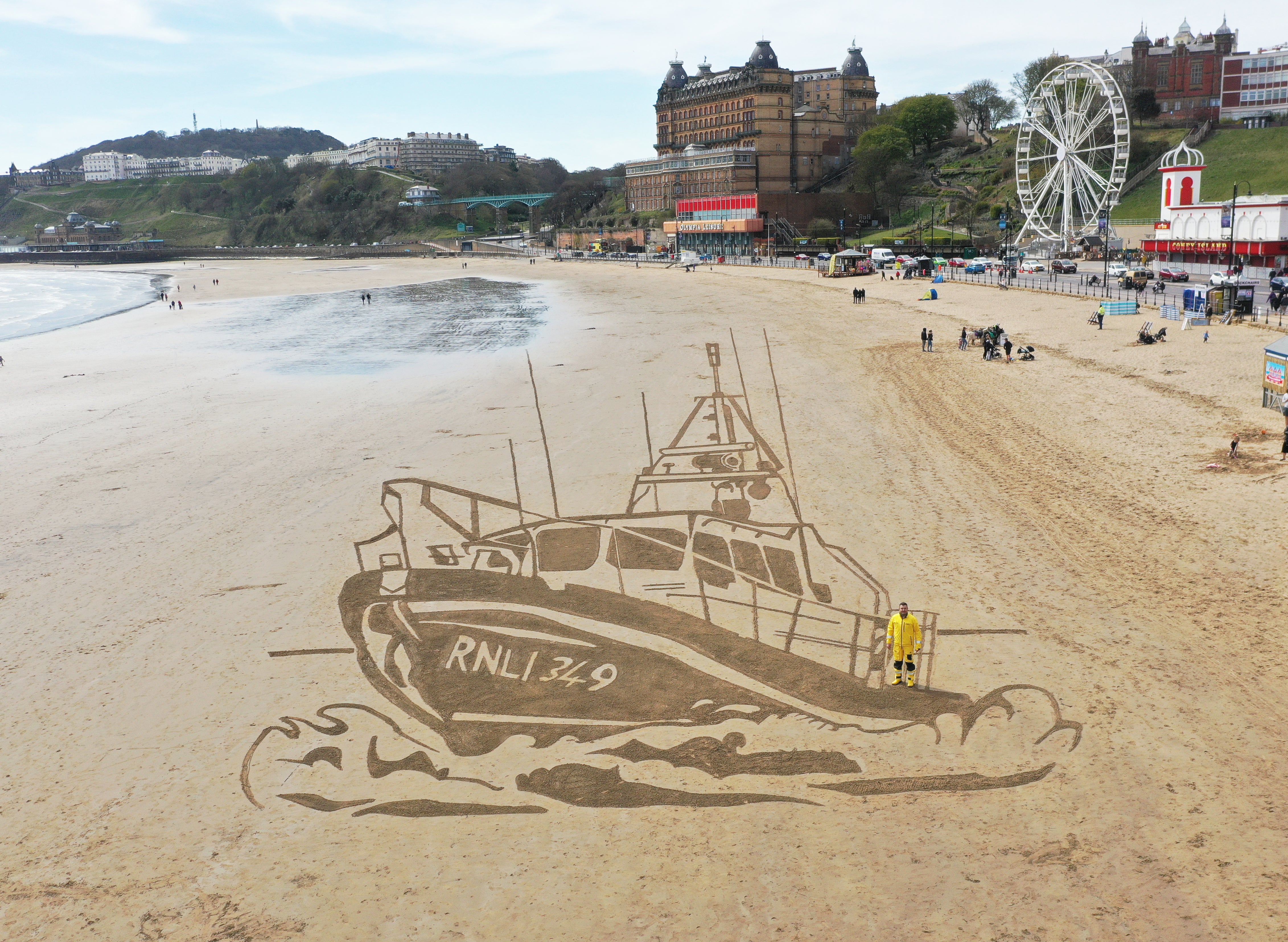 RNLI boat drawn in sand