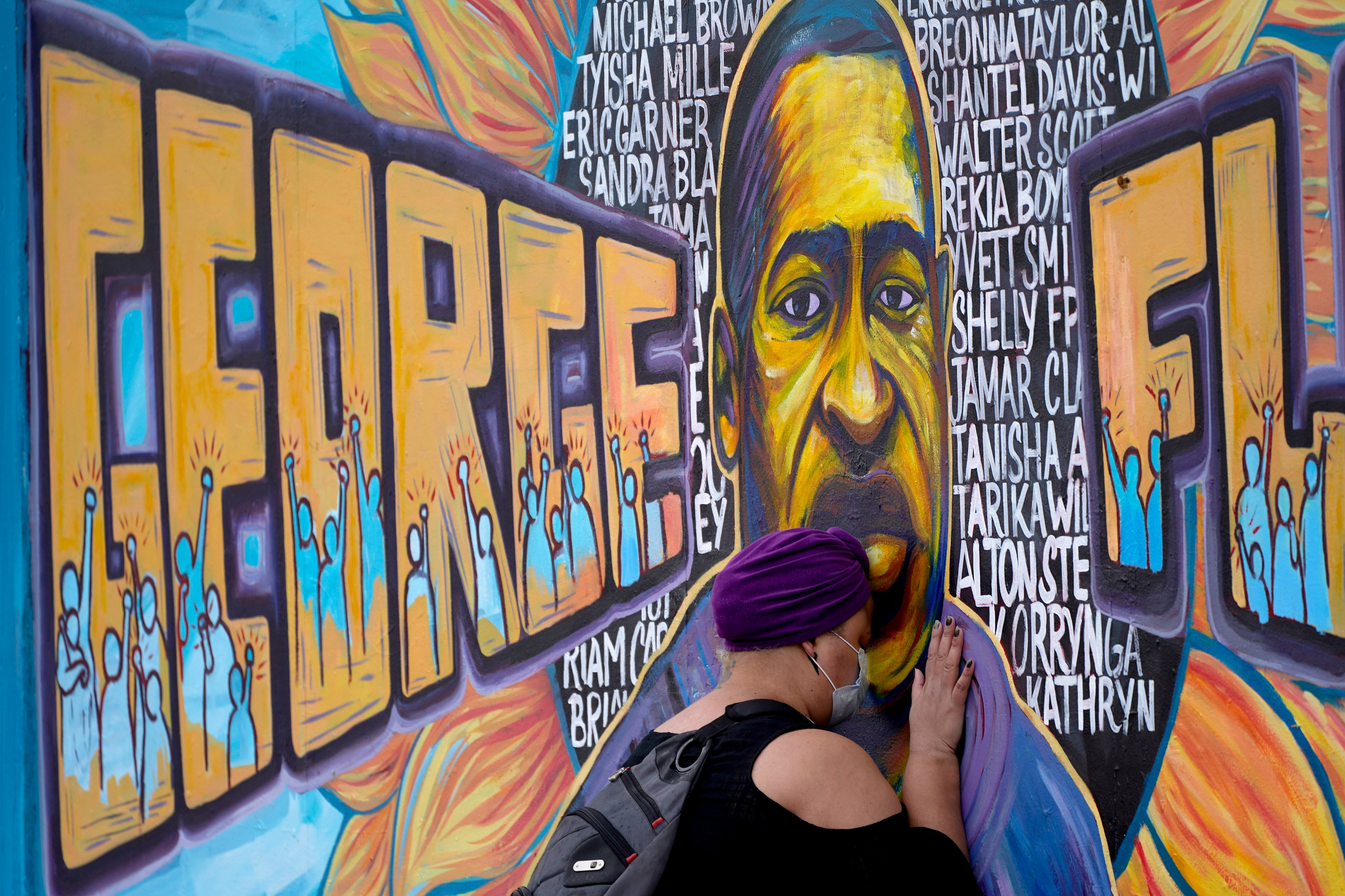 Damarra Atkins paid her respects to George Floyd at a mural at George Floyd Square, Friday, April 23, 2021, in Minneapolis, where he was killed in May 2020.