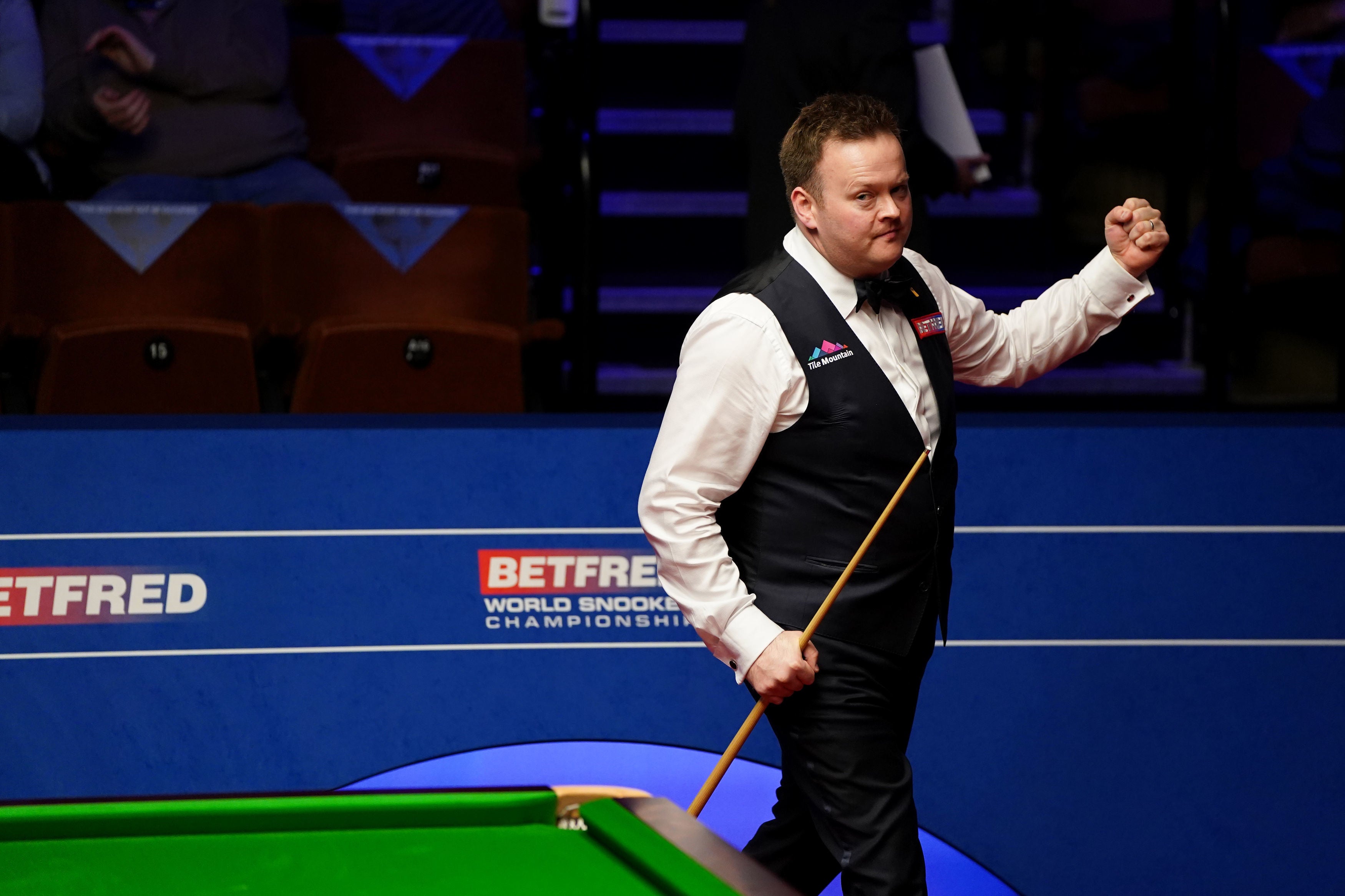 Shaun Murphy celebrates after knocking out Judd Trump