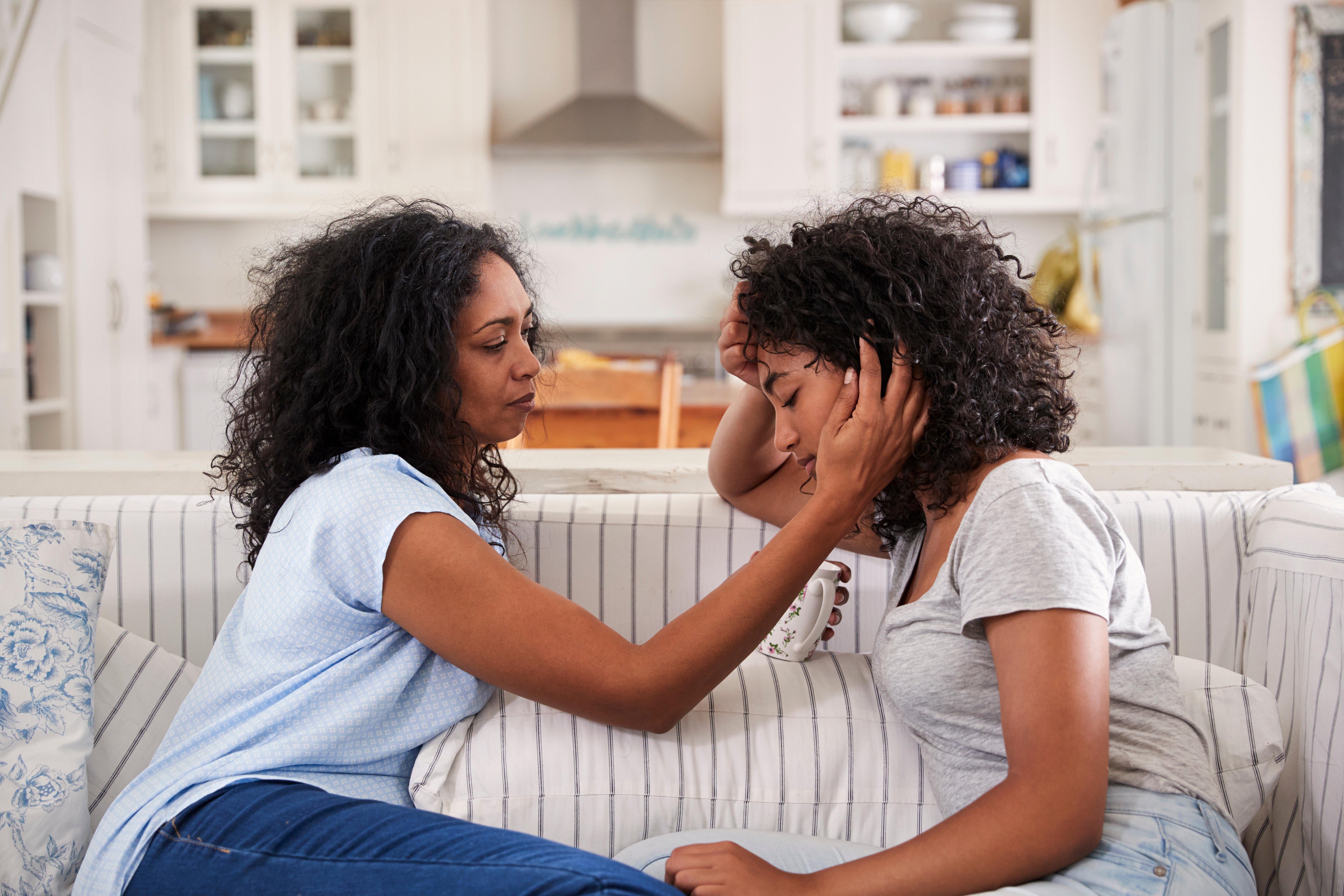 Mother comforts her heartbroken daughter