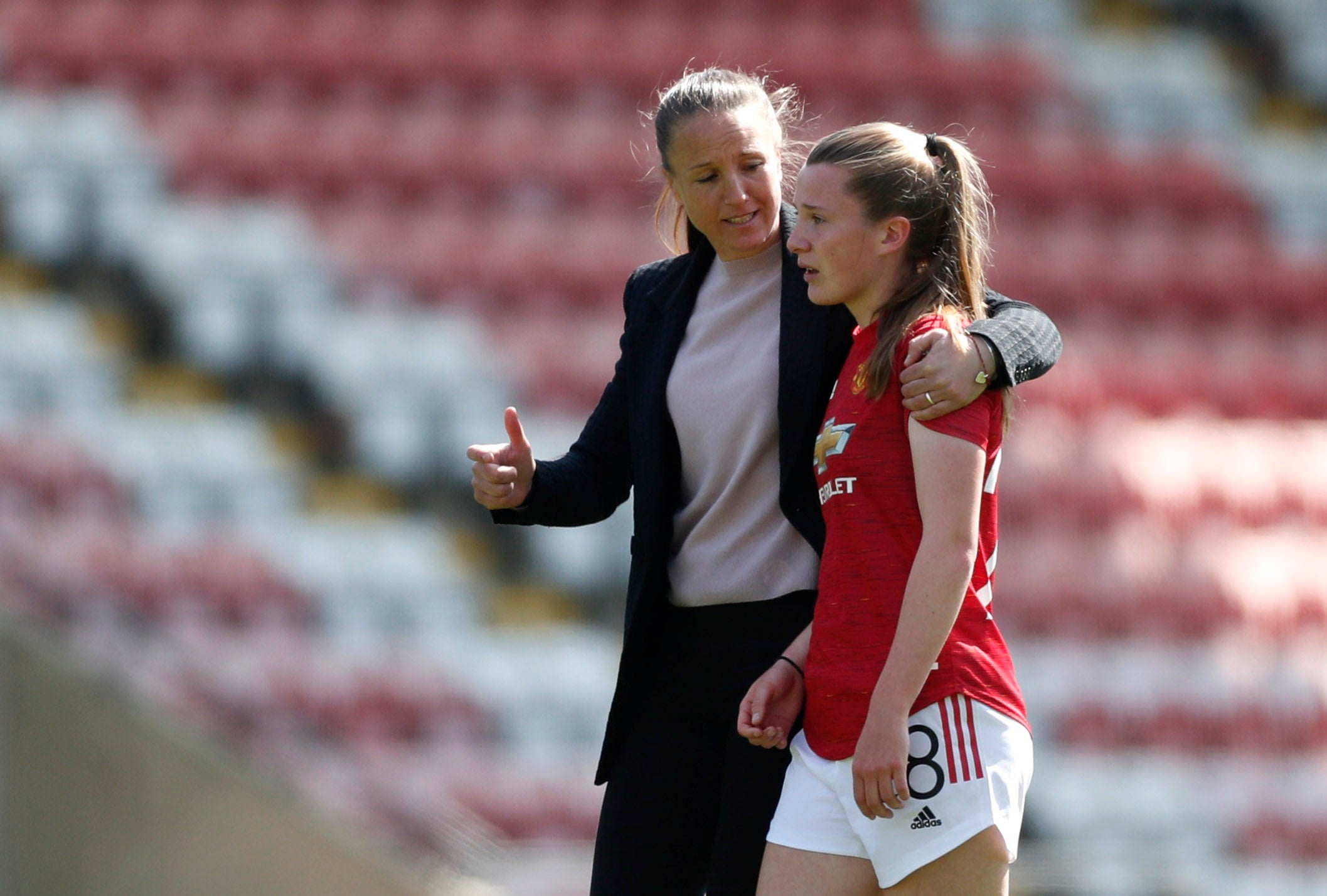 Casey Stoney speaking to United’s Carrie Jones