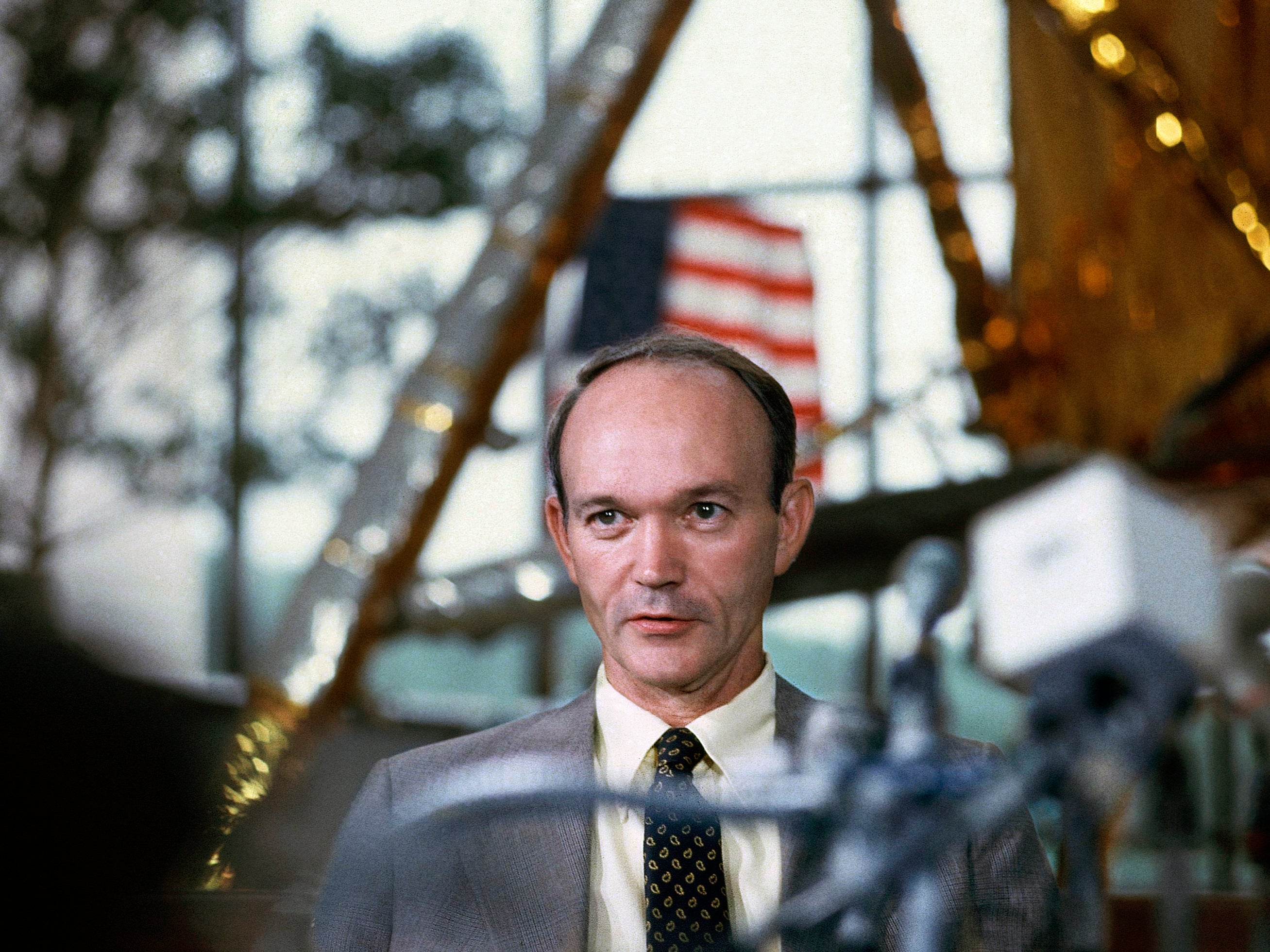 Collins attends a news conference on the 10th anniversary of the moon landing