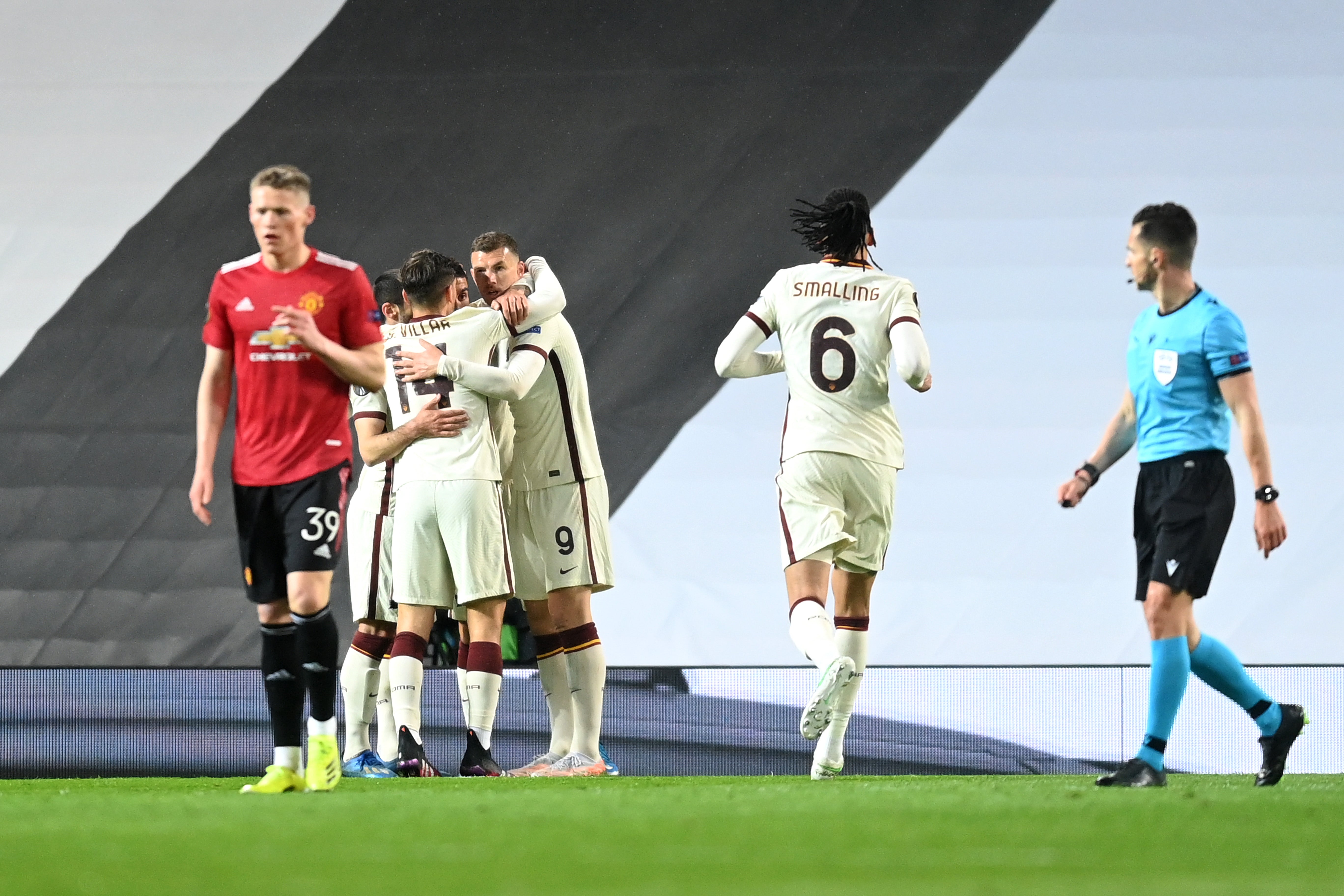 Edin Dzeko of Roma celebrates with teammates