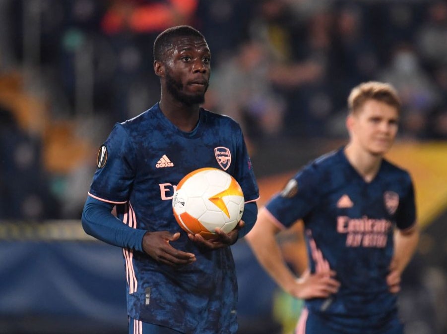 Nicolas Pepe reacts after scoring from the penalty spot