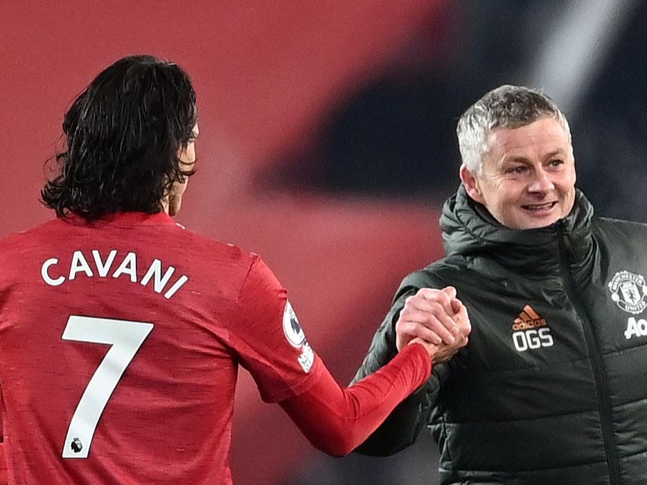 Manchester United coach Ole Gunnar Solskjaer with Edinson Cavani