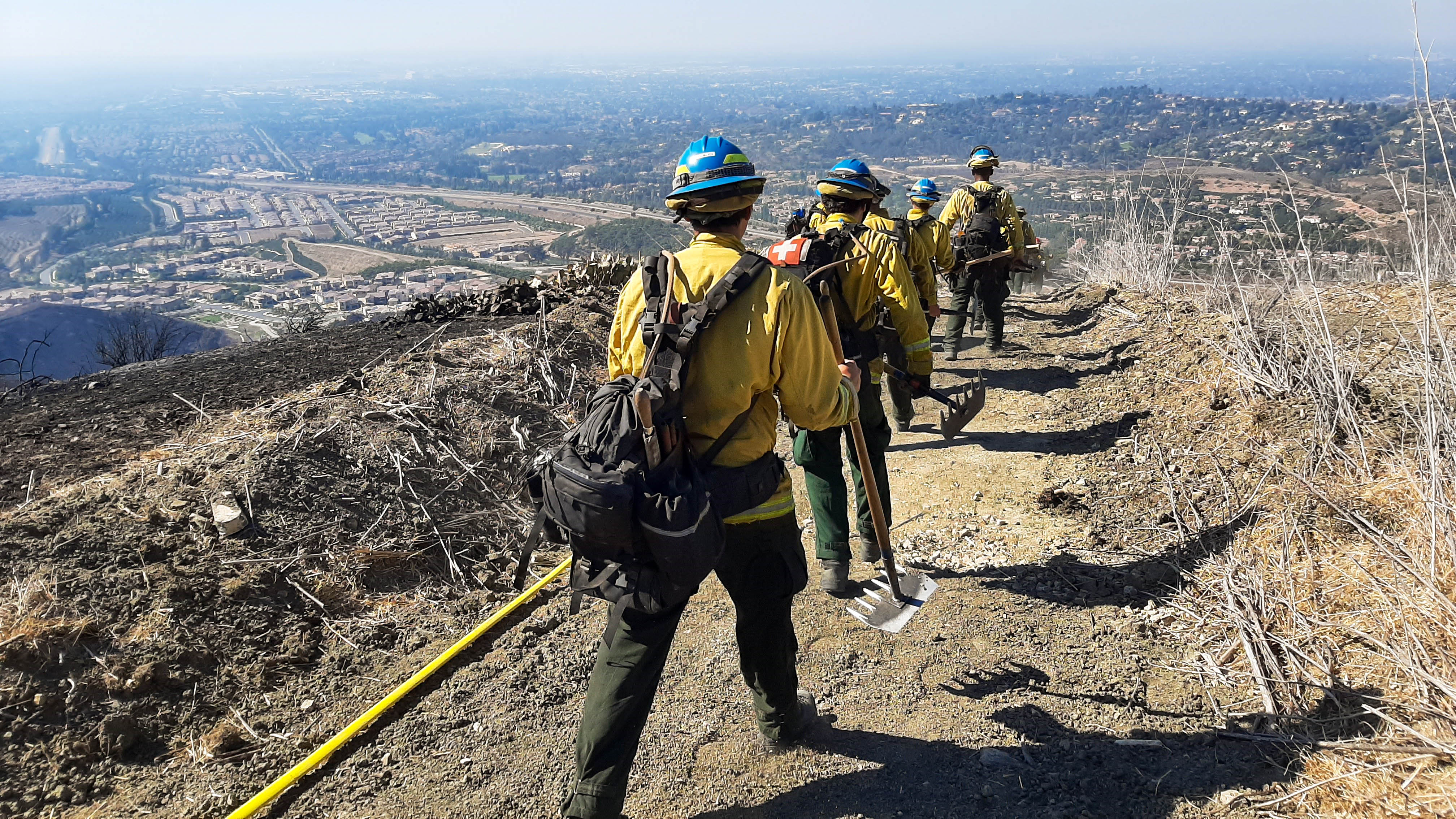 CCC crews from the Los Padres in San Luis Obispo hike to flames of the Blue Ridge Fire that burned nearly 14,000 acres in Orange County neighborhoods