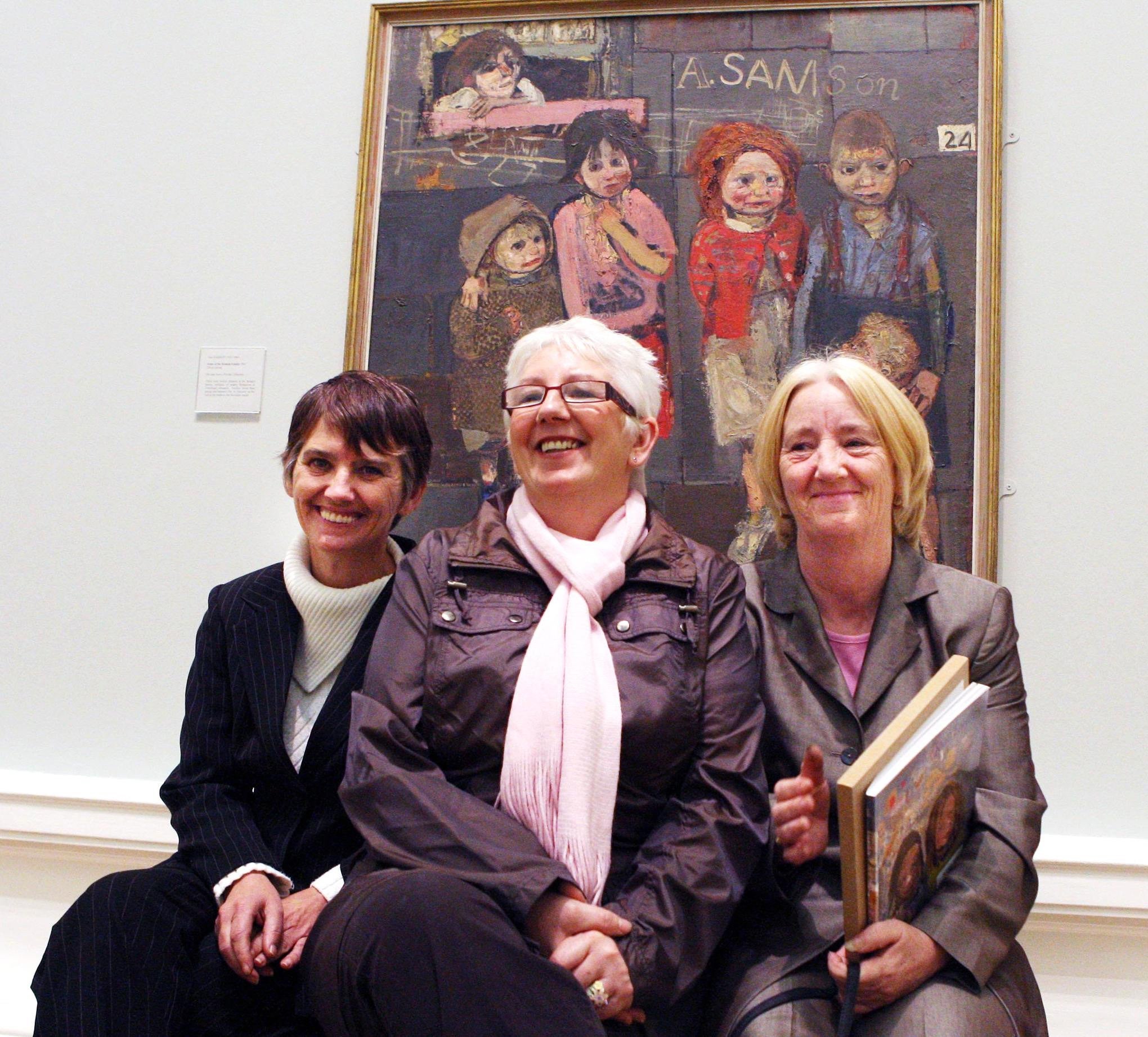 Ann McKenna, Mary McDonald and Pat McLean, some of the children depicted in the painting behind