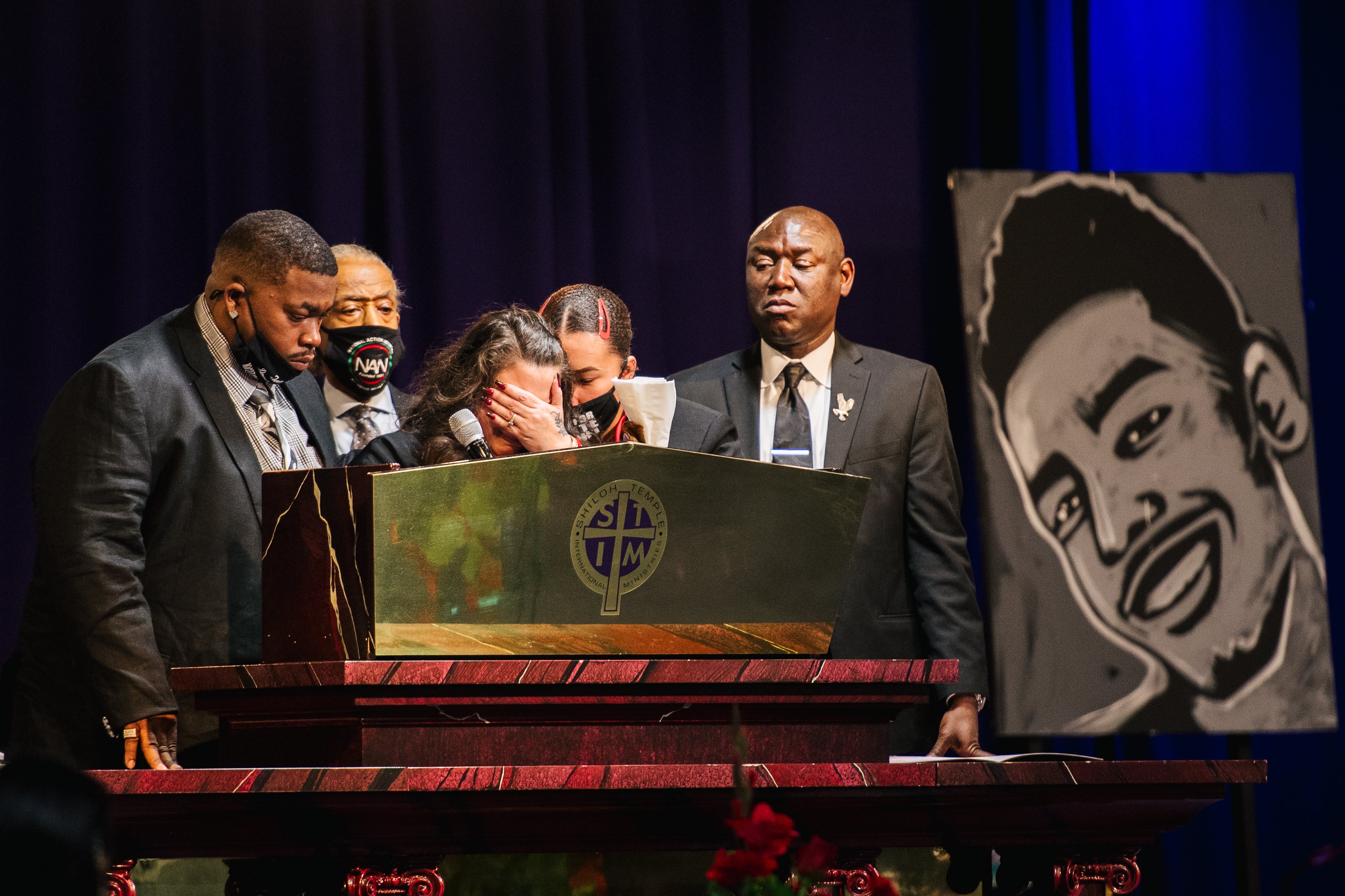 Al Sharpton and Ben Crump stand alongside the young man’s parents