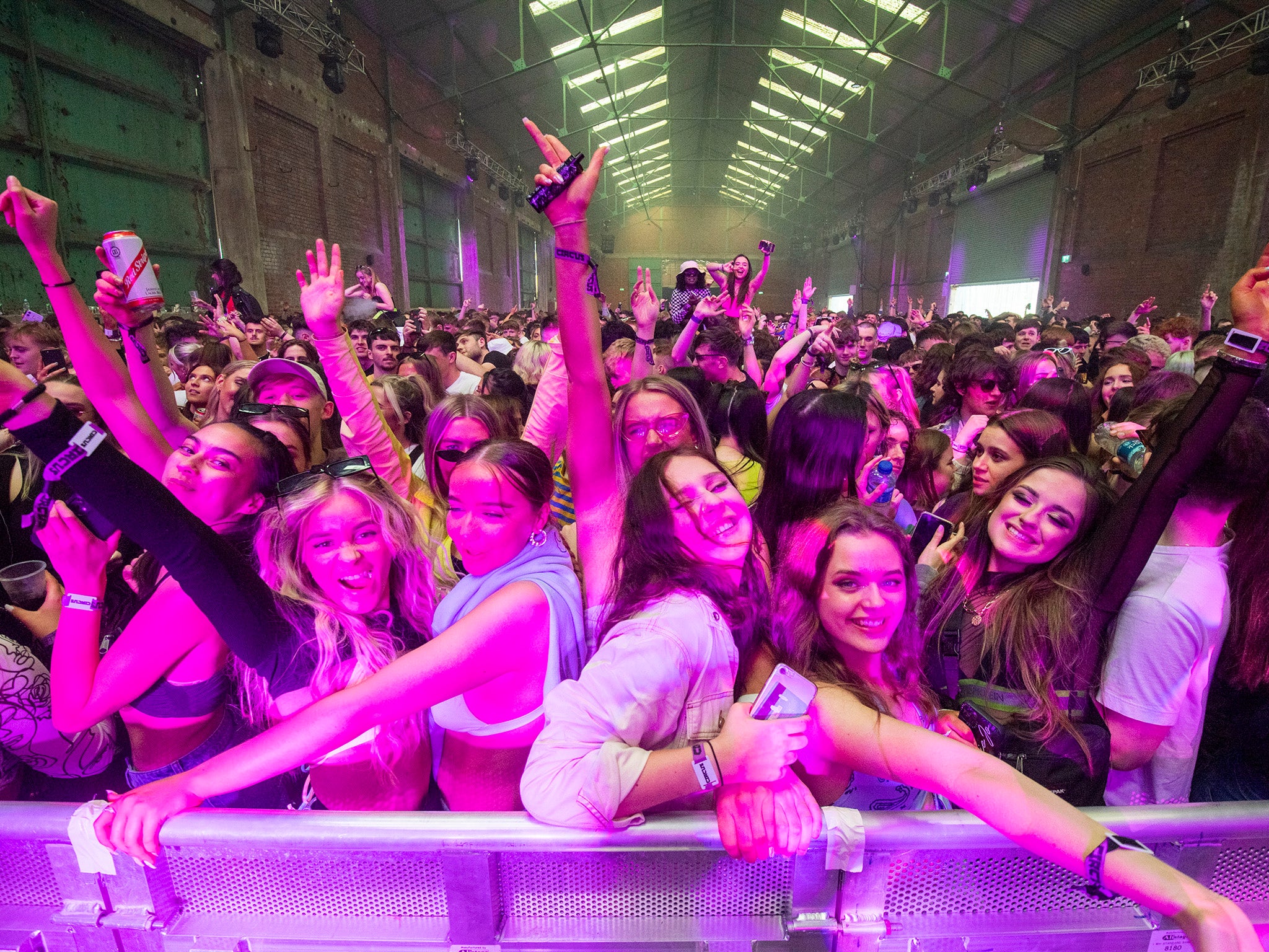 Thousands of clubbers descend on Liverpool docks for Britain’s first legal rave in more than a year