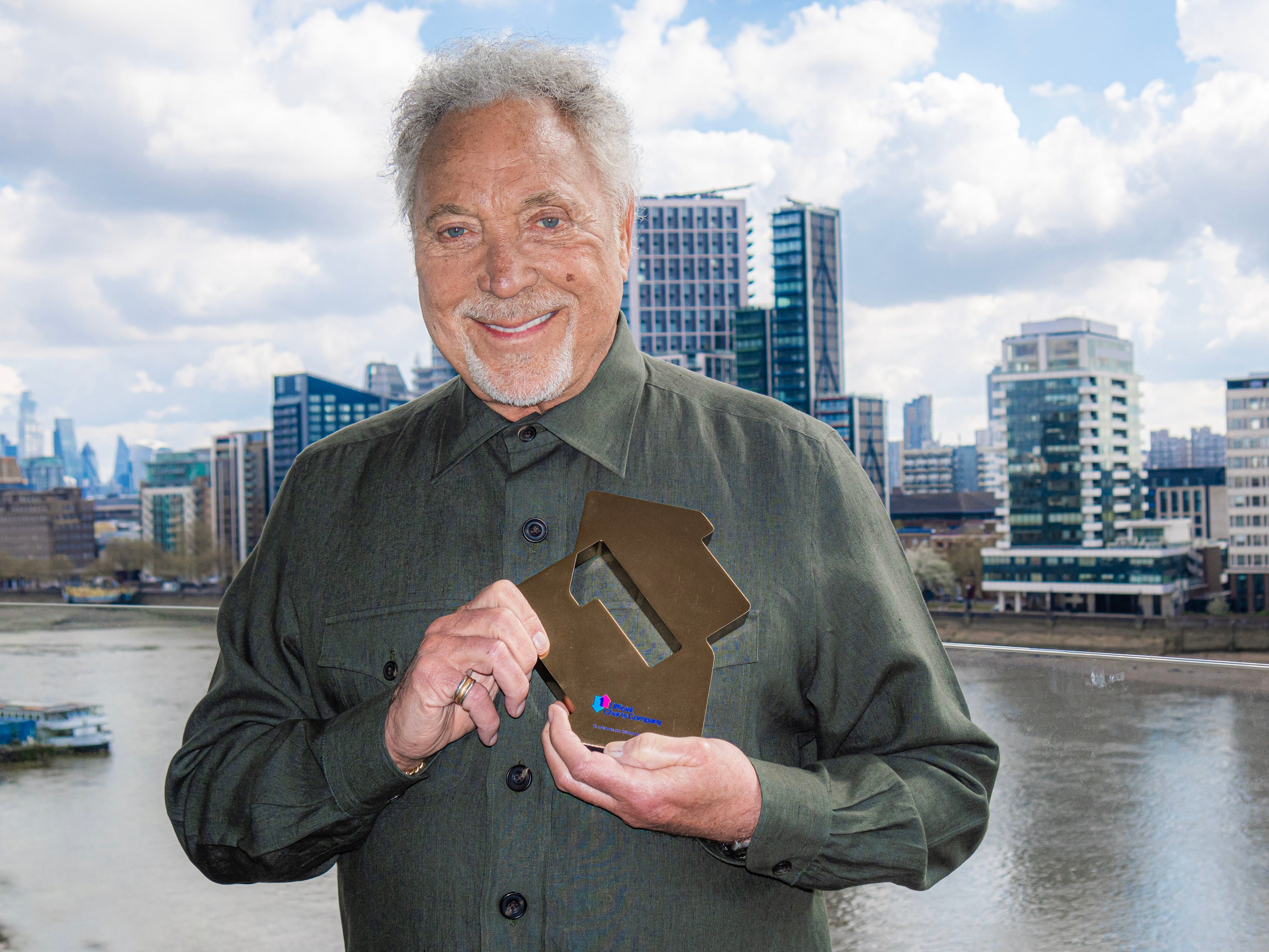 Jones posing with his Official No 1 Album Award