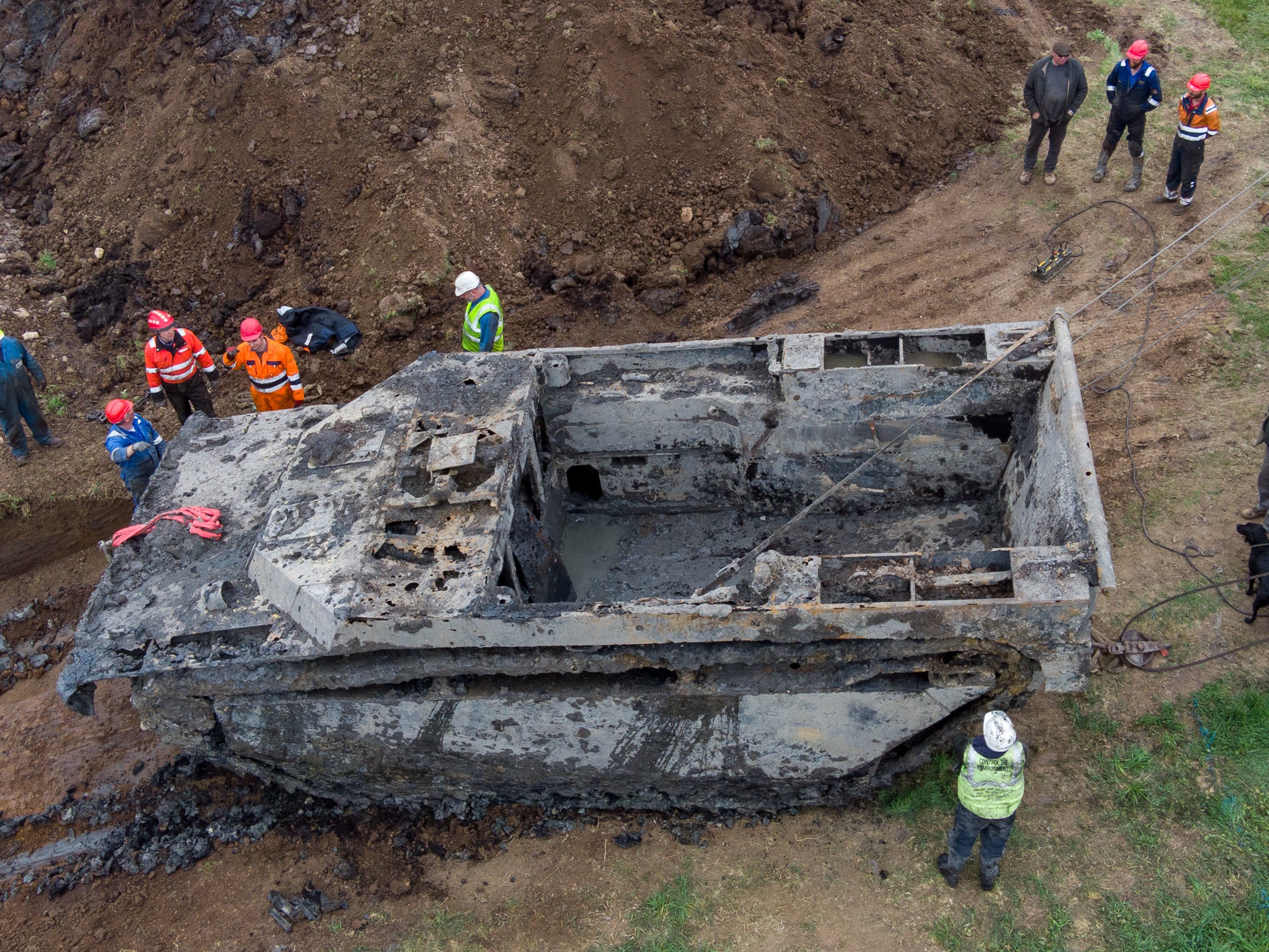 The tank, which is 26 feet long and weighs 20 tons, was buried 30 feet underground in Cambridgeshire Fens