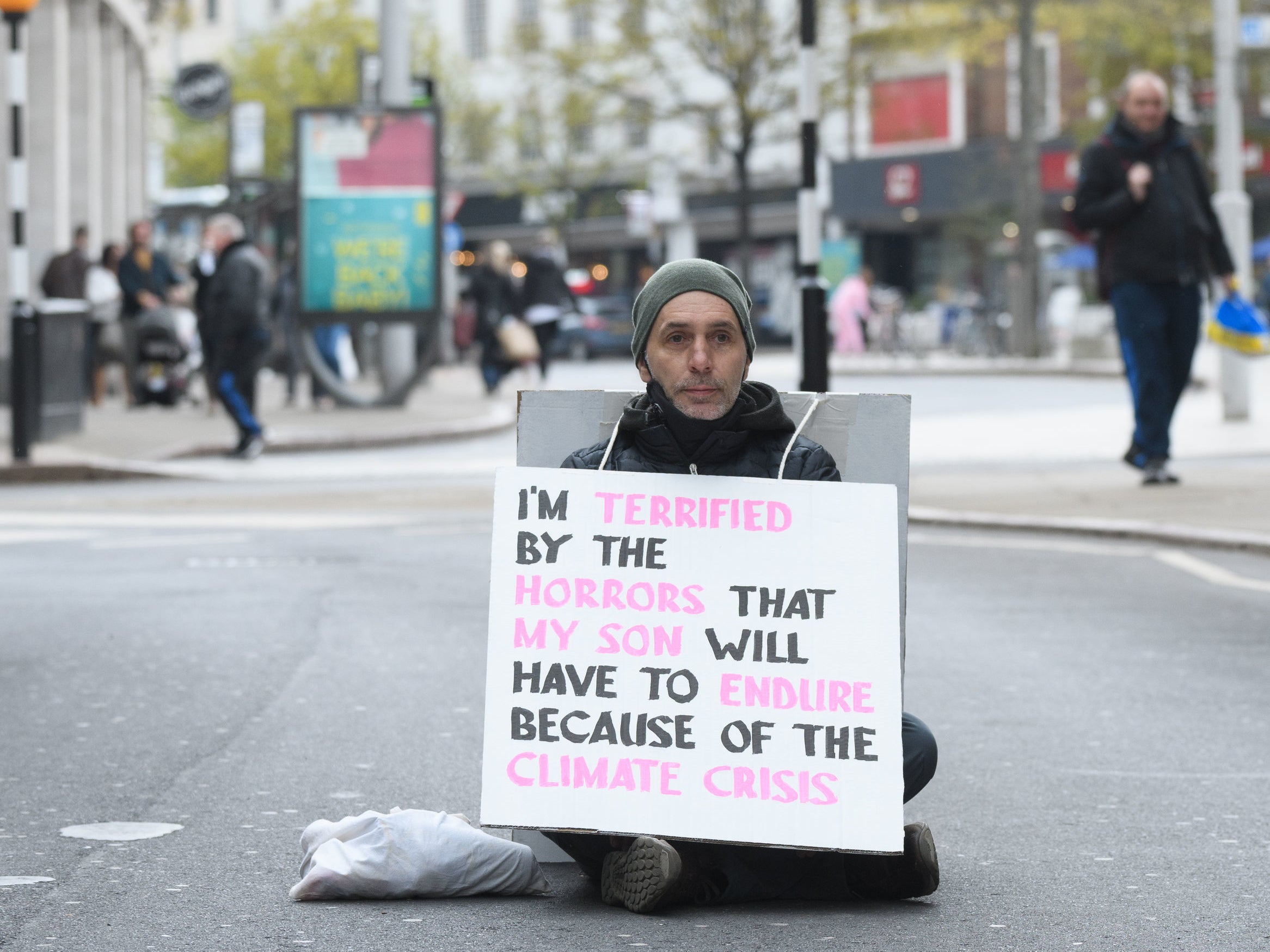 A protester blocks traffic in Nottingham as part of the “Rebellion of One” day of action