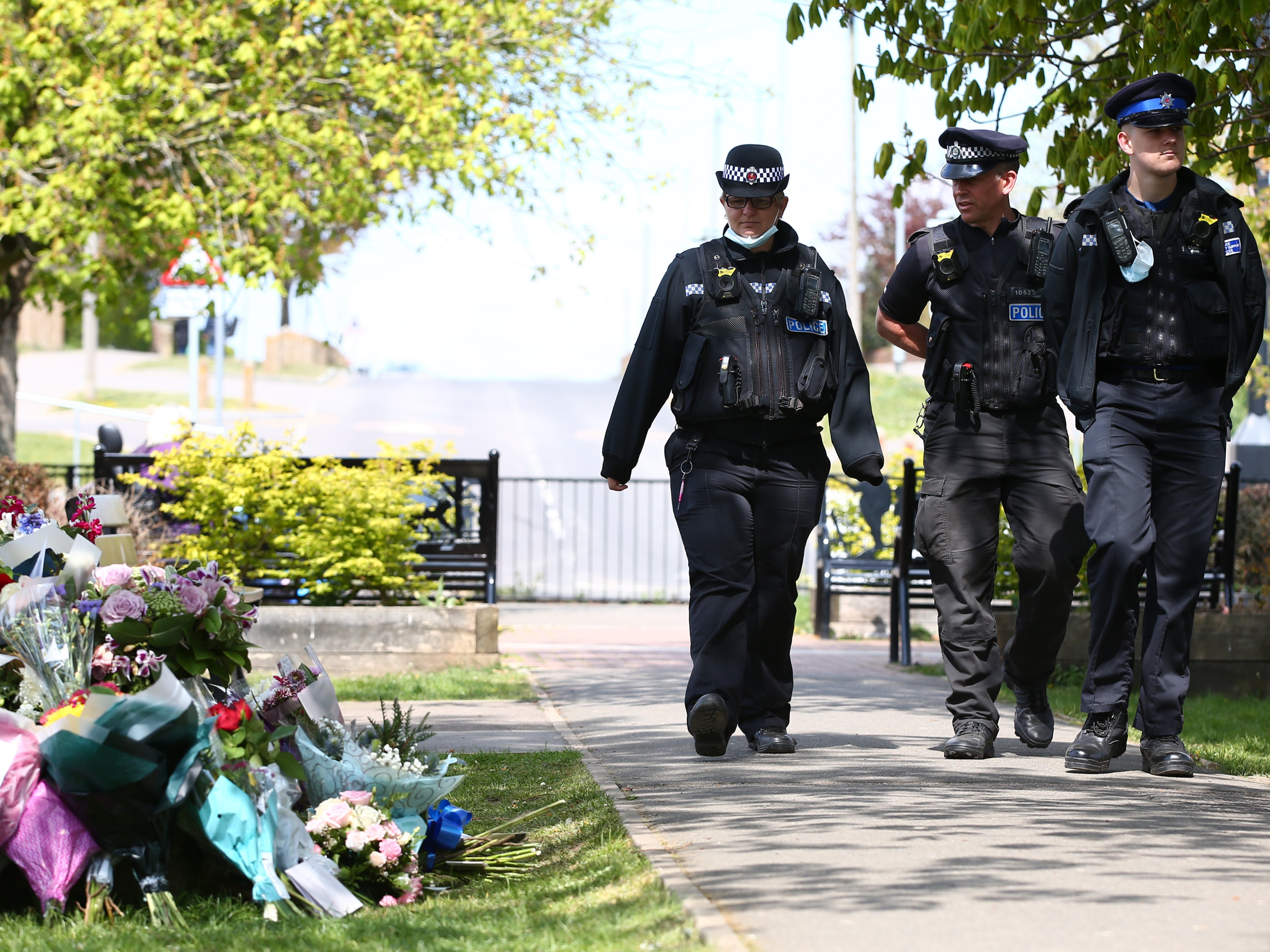 Police officers view floral tributes for murdered PCSO Julia James in Aylesham