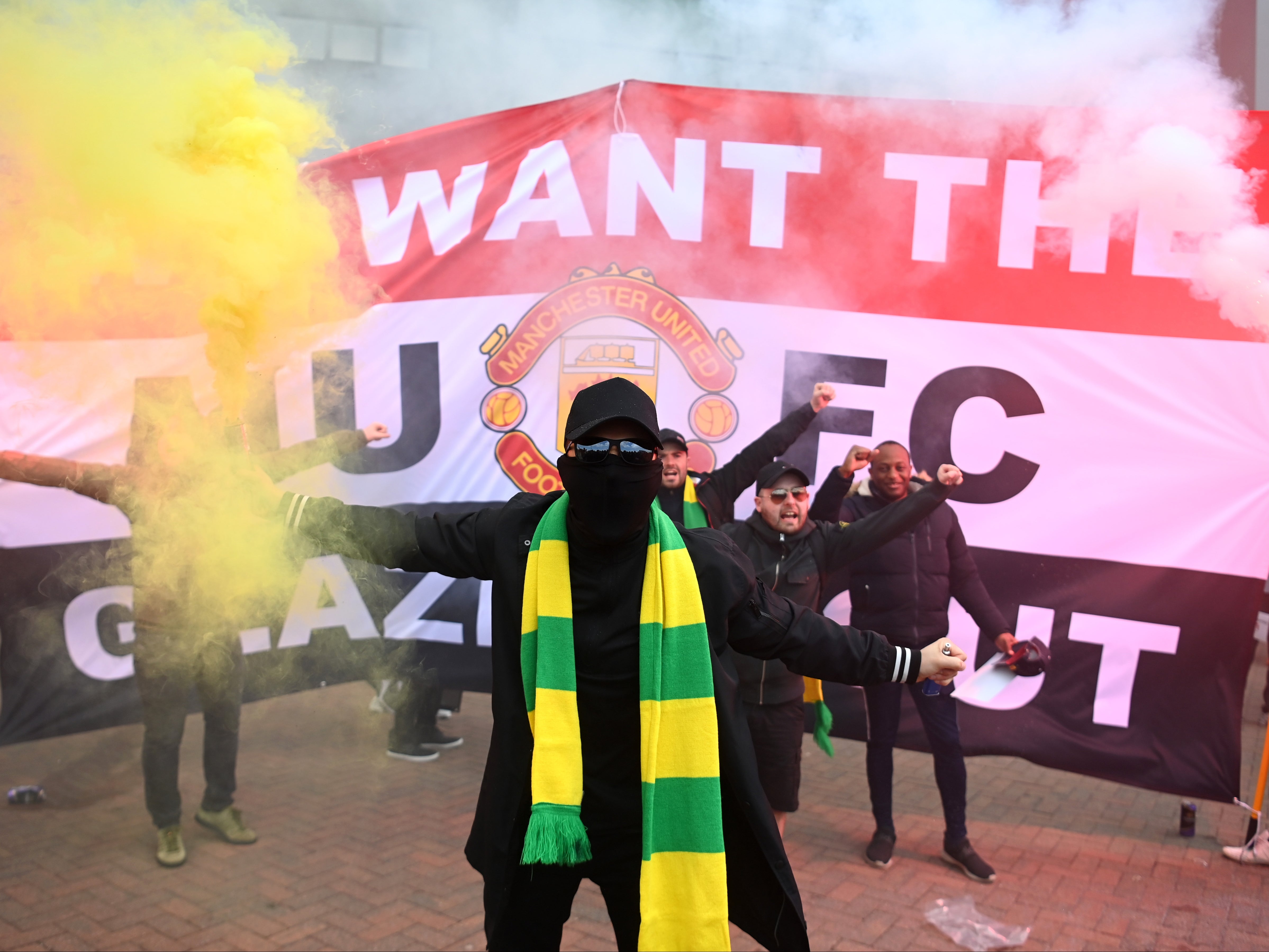 Manchester United supporters protesting outside Old Trafford