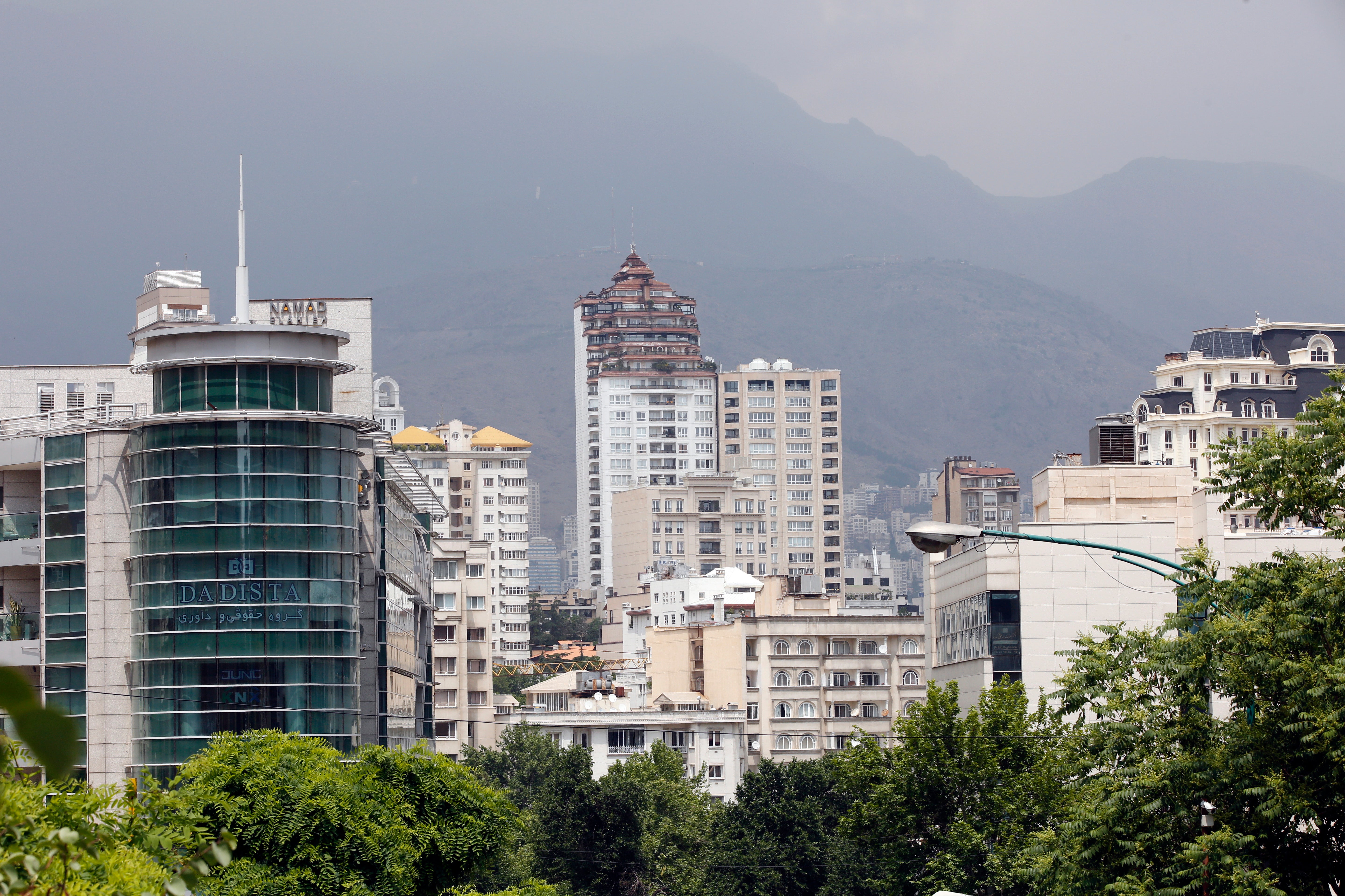 The woman fell to her death in the upmarket Kamranieh neighbourhood in Tehran