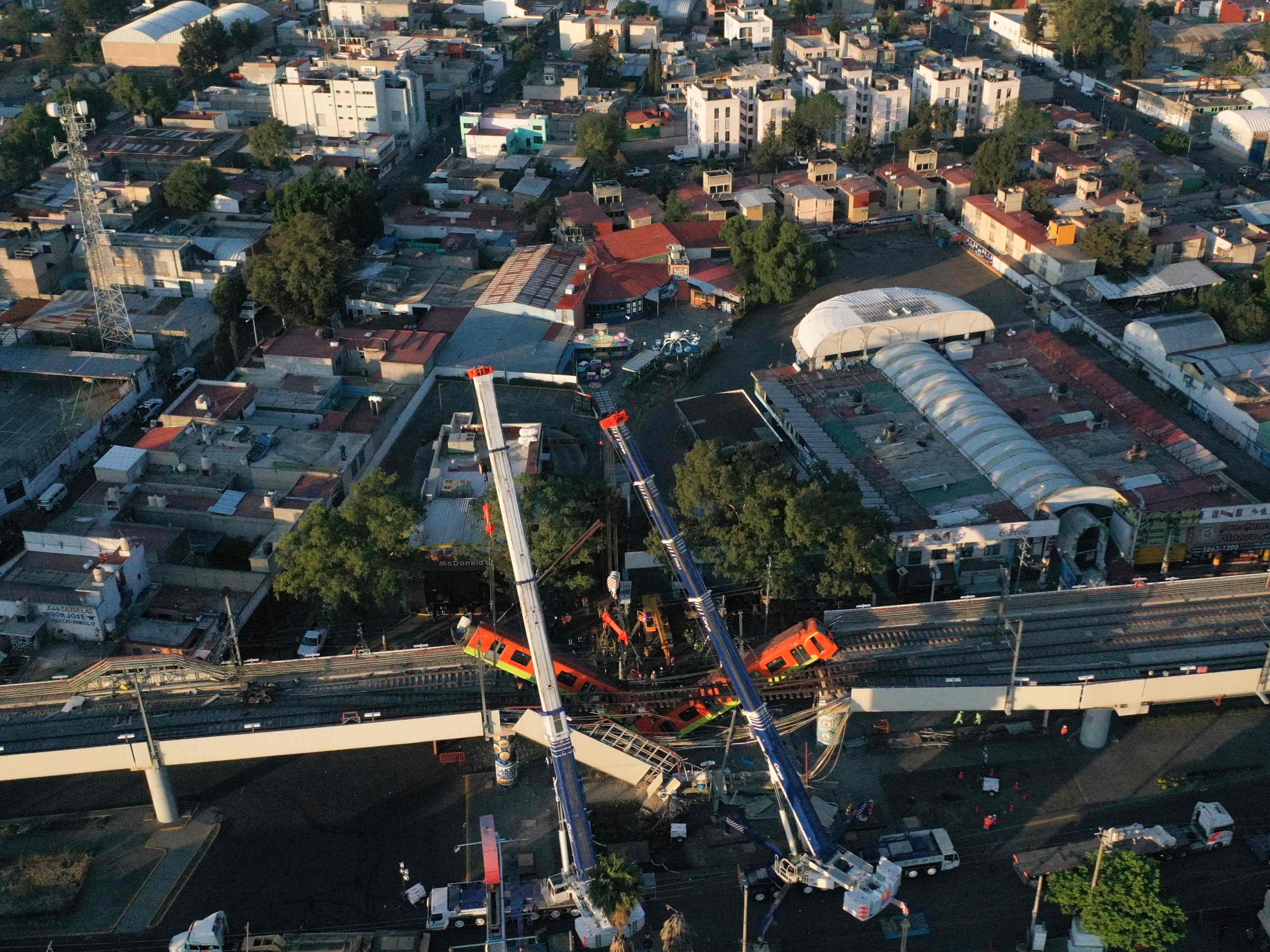 An aerial view shows the site of a metro train accident after an overpass for a metro partially collapsed in Mexico City on May 4, 2021.