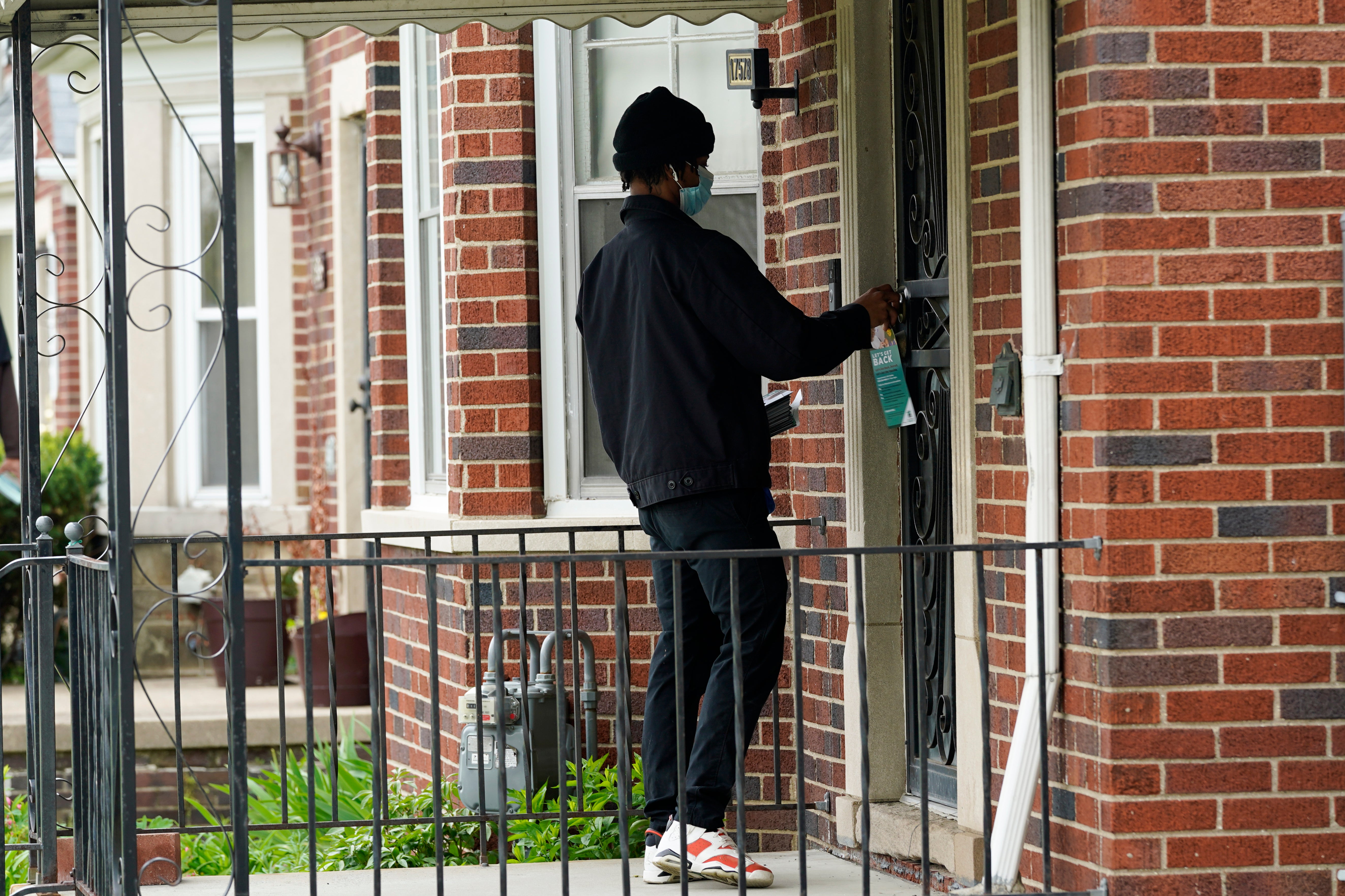 Virus Outbreak Detroit Door Knocking