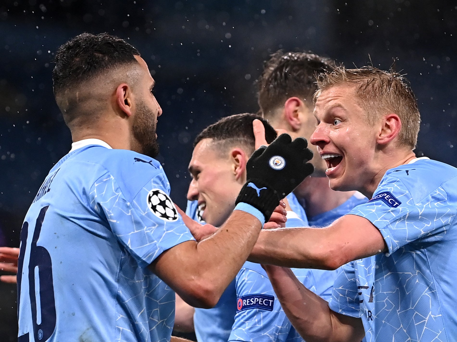 Riyad Mahrez (left) celebrates with Man City defender Oleksandr Zinchenko