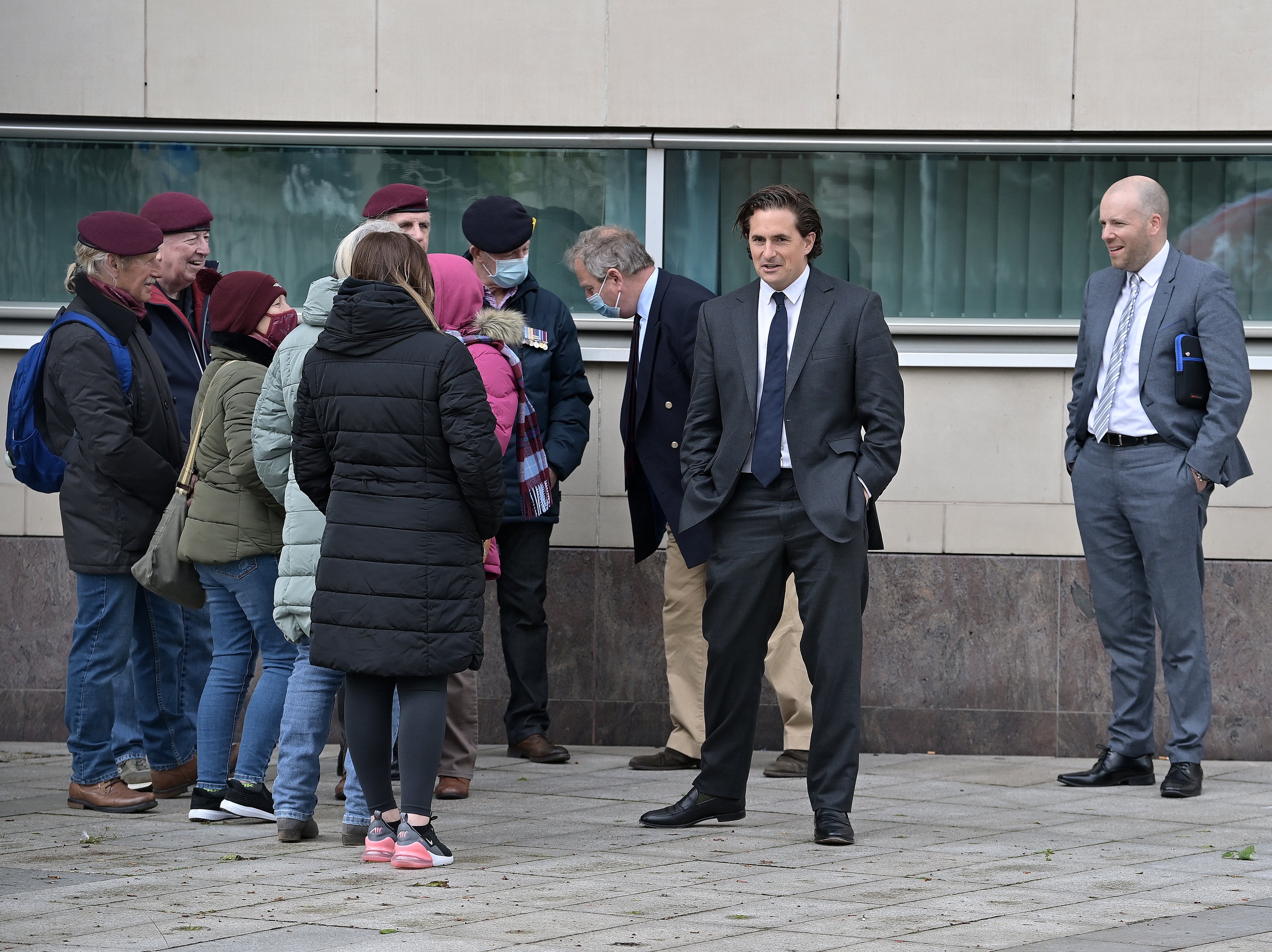 Former veterans minister Johnny Mercer (second from right) said it was time for the government to deliver on its promise to protect former soldiers