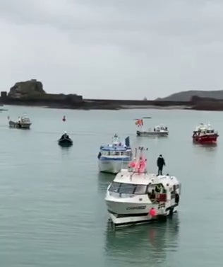 French fishing boats arrive to stage a protest outside the harbour of St Helier, Jersey, on Thursday morning.