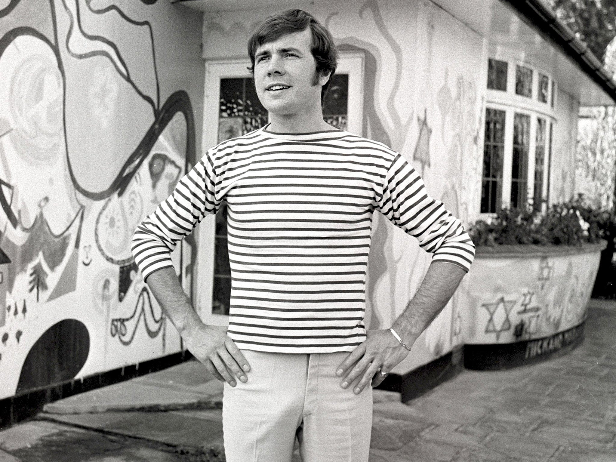 Mason outside a house he bought from George Harrison