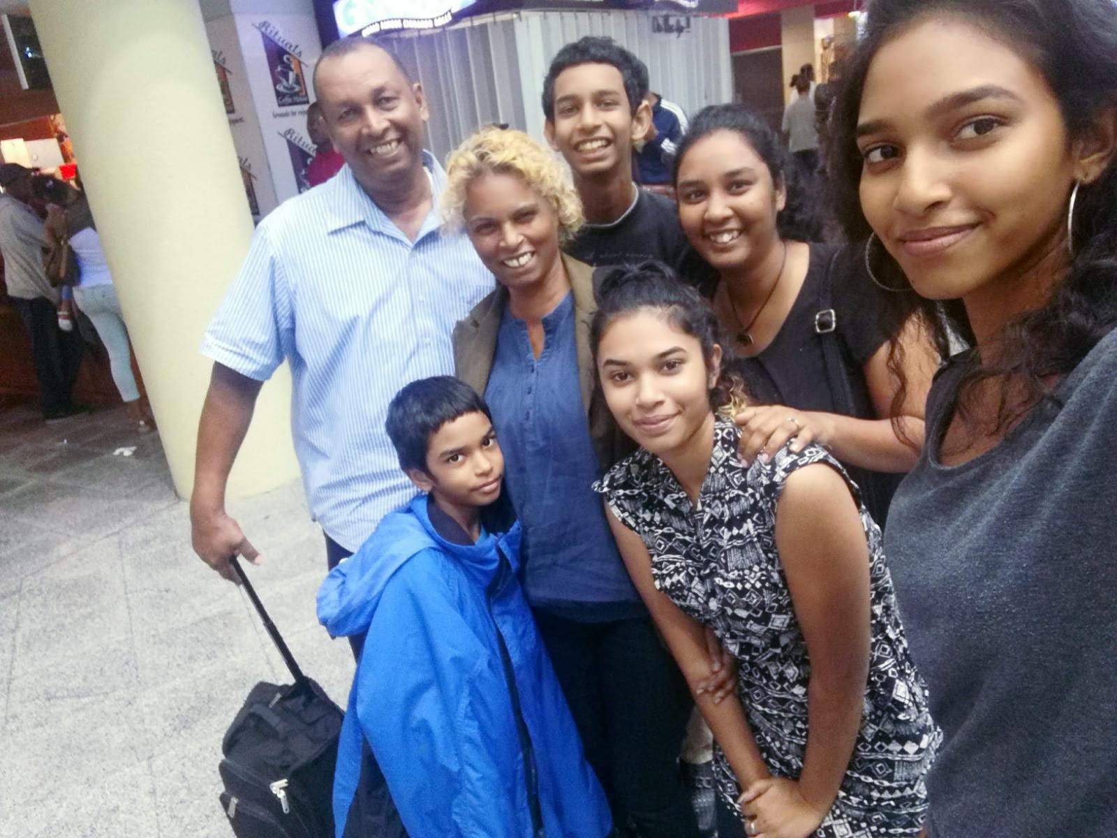 Lynda Mahabir (second left) had hoped it would be a matter of months before her family would be able to join her when she left for the UK in October 2018 – but they are still apart