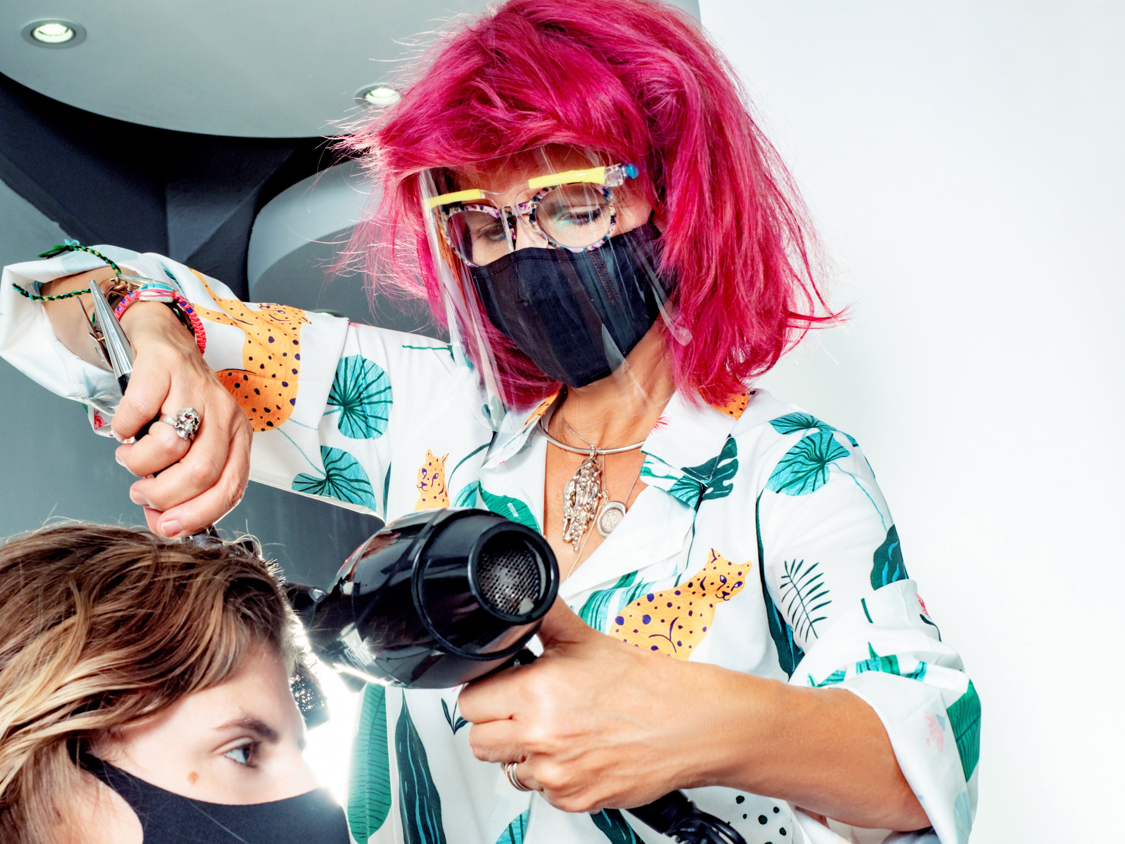 Anne Veck cuts a customer’s hair after the Oxford salon reopened in April