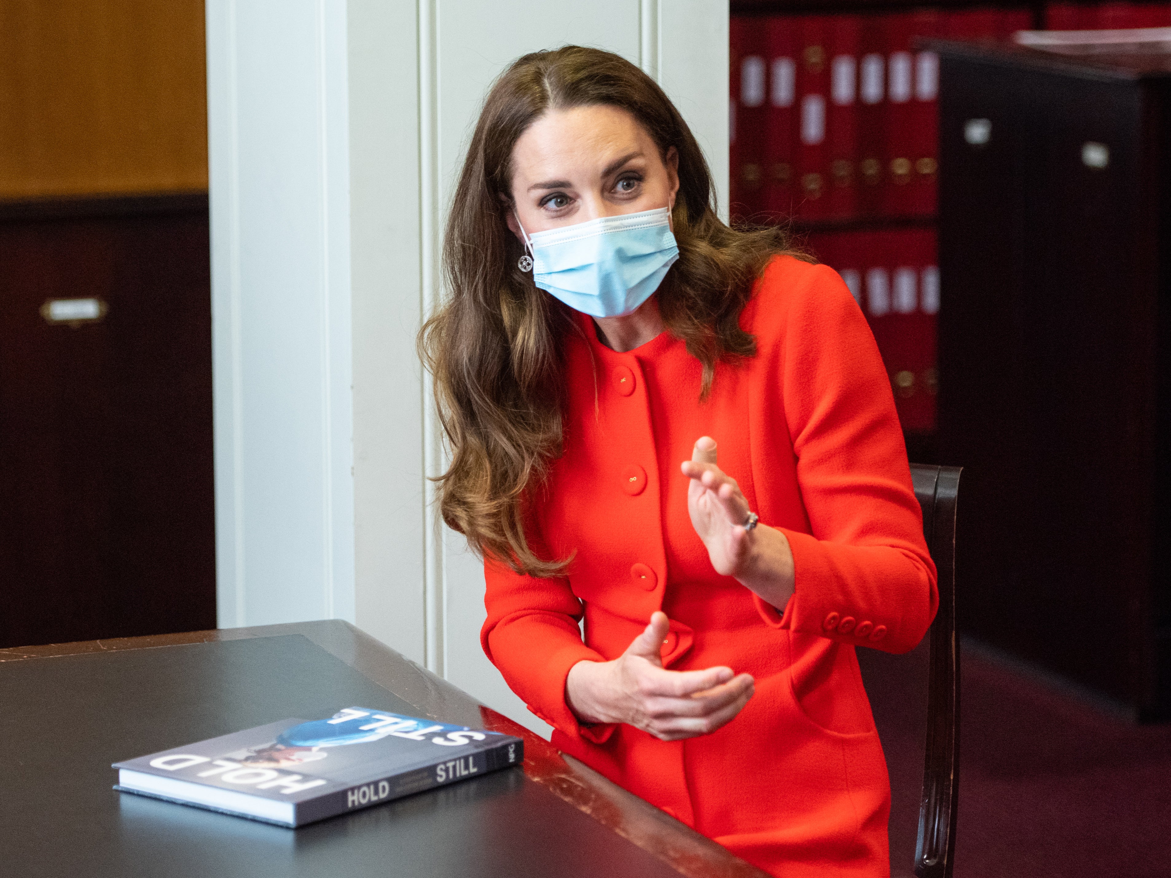 The Duchess of Cambridge talks to ‘Hold Still’ entrants during a visit to the archive in the National Portrait Gallery