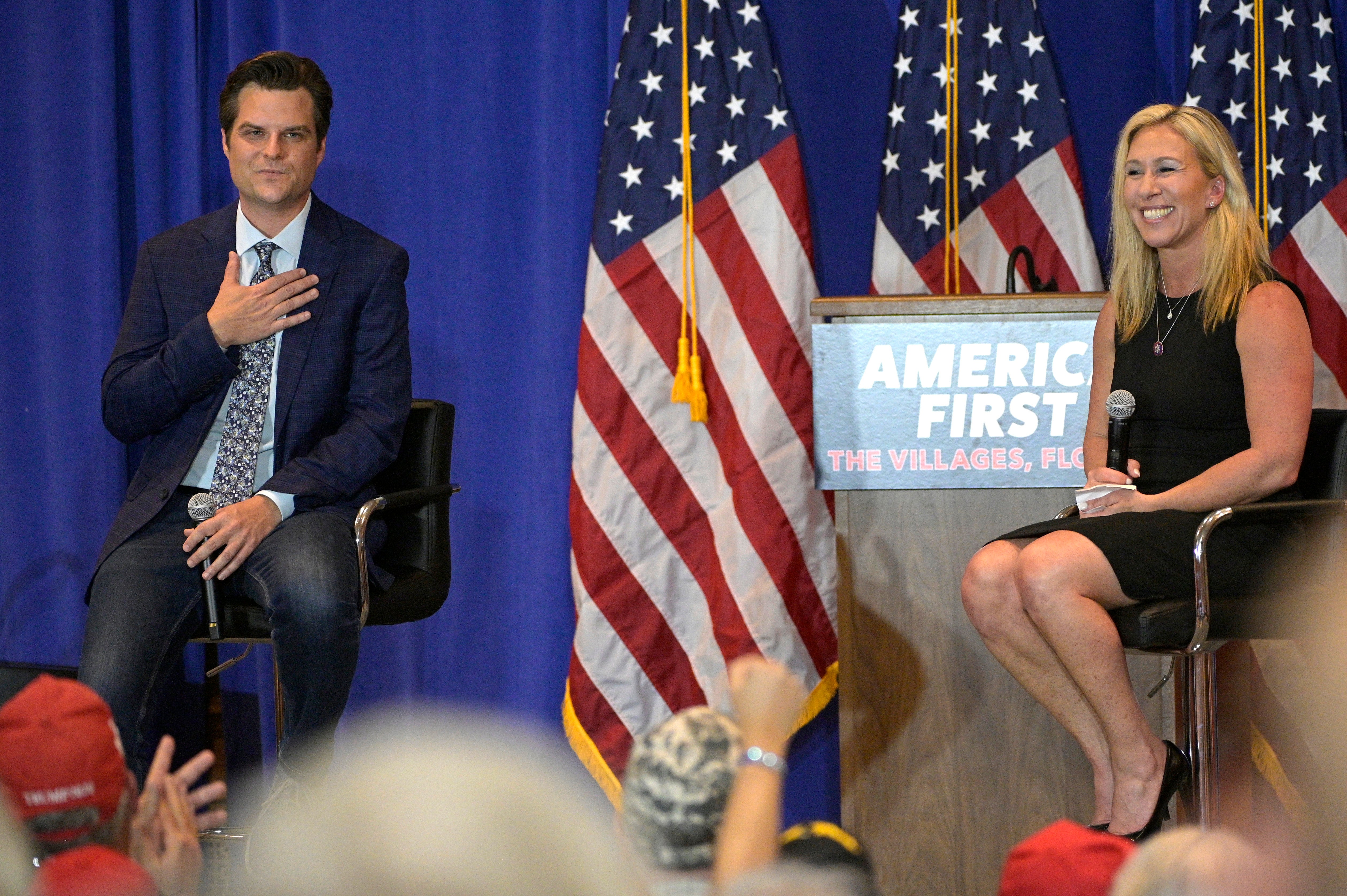 Rep. Matt Gaetz, R-Fla., left, and Rep. Marjorie Taylor Greene, R-Ga., address attendees of a rally, Friday, May 7, 2021, in The Villages, Fla.