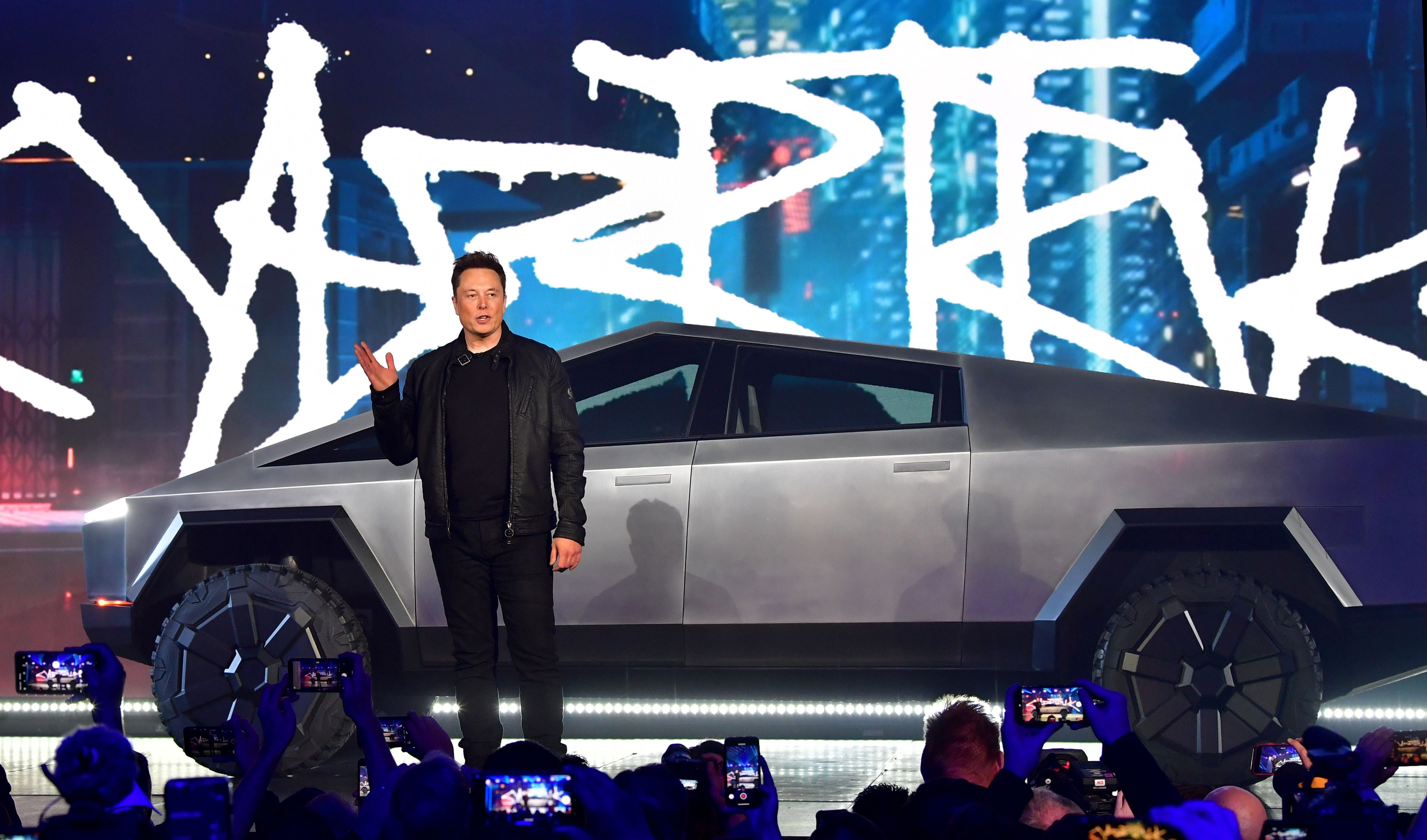 Tesla co-founder and CEO Elon Musk introduces the newly unveiled all-electric battery-powered Tesla Cybertruck at Tesla Design Center in Hawthorne, California on November 21, 2019