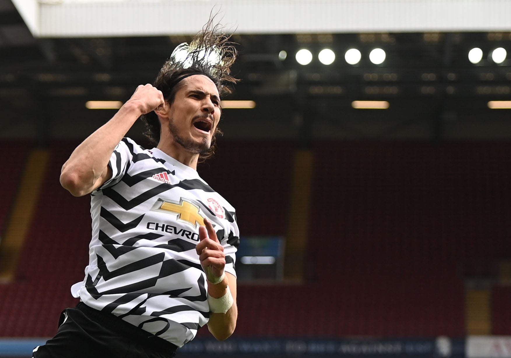 Edinson Cavani celebrates after scoring United’s third goal