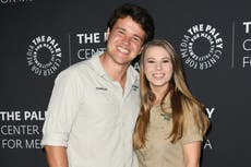 Bindi Irwin celebrates her first Mother’s Day with portrait showing her late father holding her daughter