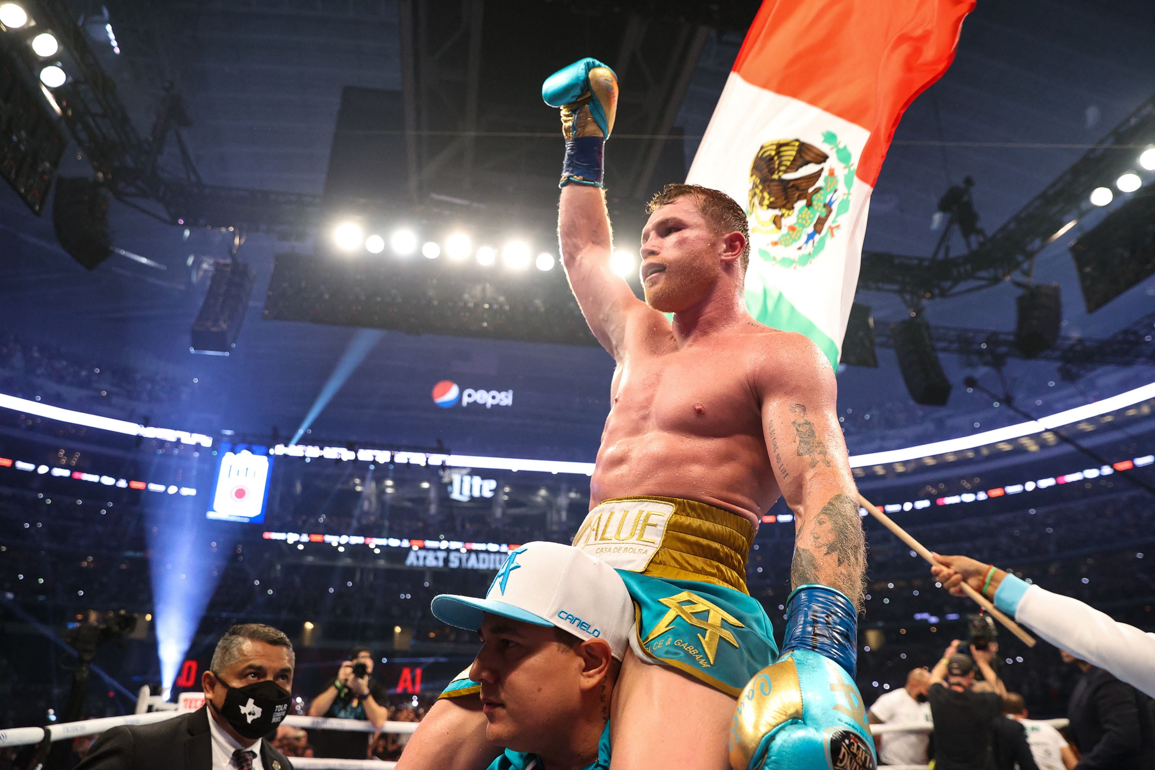 Canelo Alvarez celebrates unifying the super-middleweight division