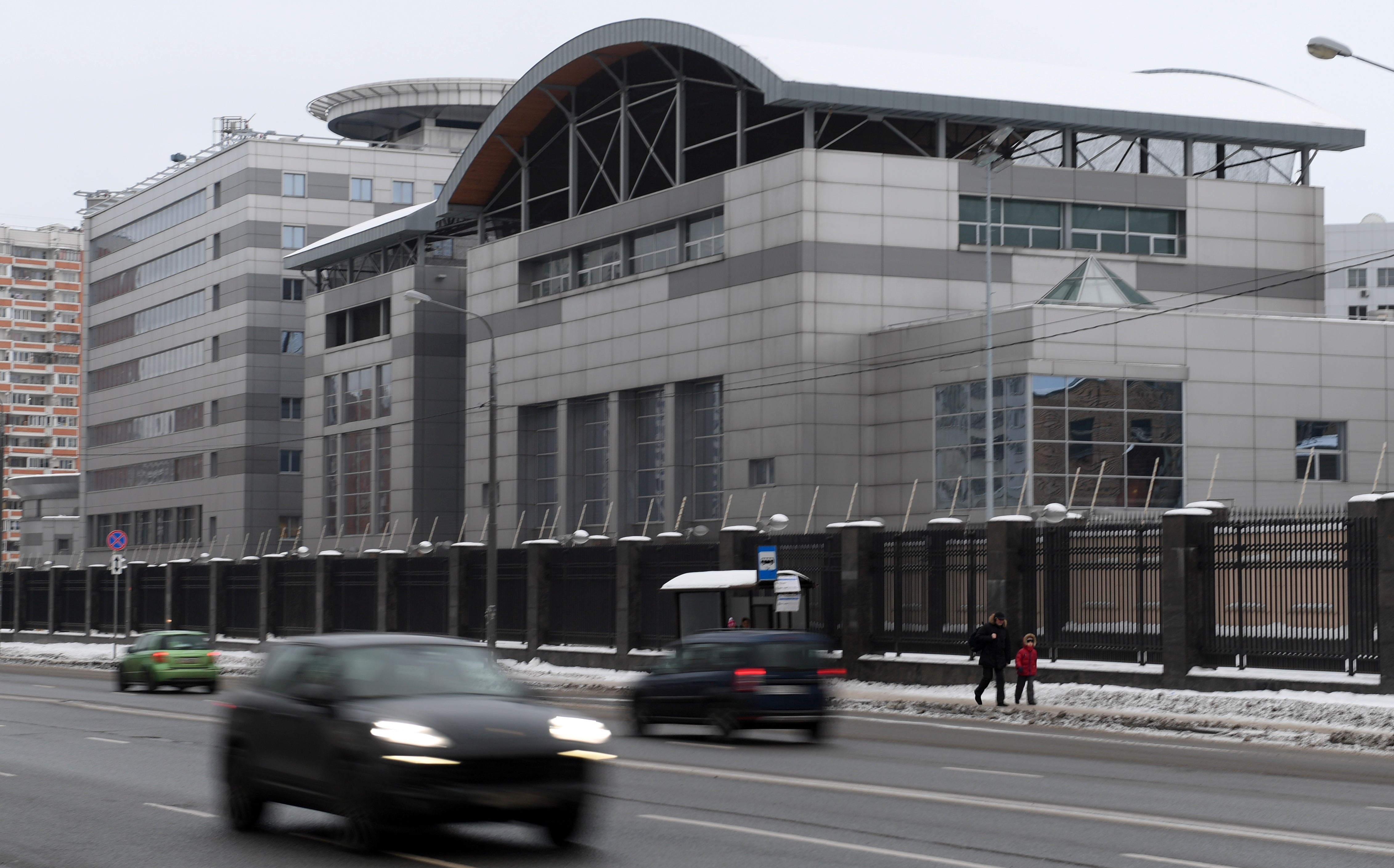 Cars drive past the headquarters of the Russian General Staff's Main Intelligence Department (GRU) in Moscow on December 30, 2016